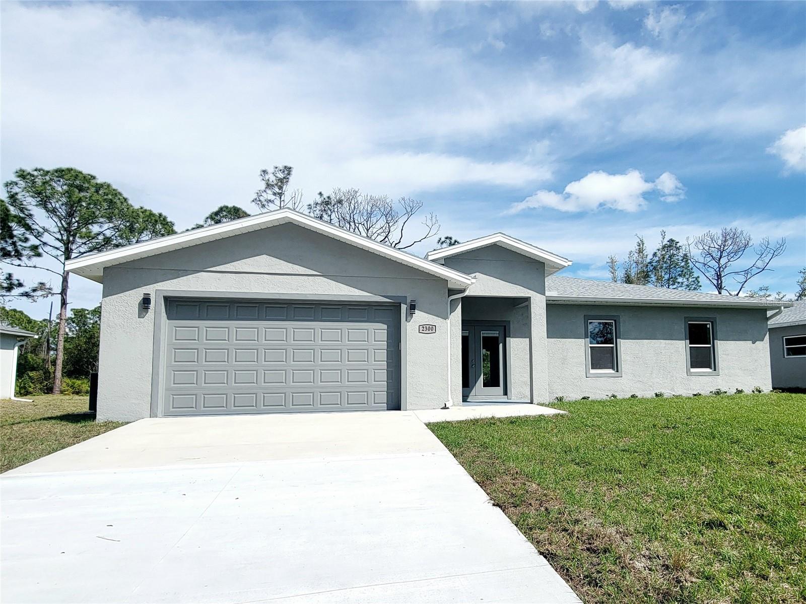 NEW HOUSE - 3 BEDROOM 2 BATH WITH IMPACT WINDOWS AND DOORS. BEAUTIFUL KITCHEN AND ISLAND WITH QUARTZ COUNTERTOPS . LUXURY VINYL ON THE MAIN HOUSE FLOORS AND PORCELAIN TILE BOTH BATHROOMS ALSO. TRAY CEILINGS, CEILING FANS , LAUNDRY ROOM WITH SINK AND NICE SIZE PORCH, IS READY TO MOVE IN !!!!!