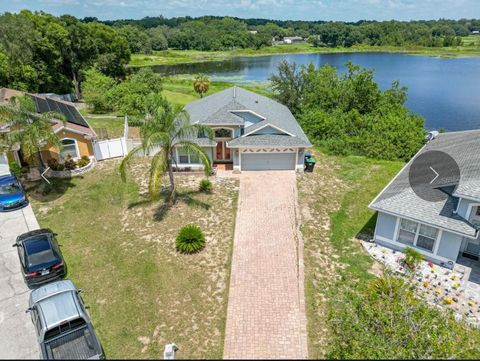 Photo of 6569 Long Breeze Road N, Orlando, FL 32810 (MLS # O6316416) Photo of 6569 Long Breeze Road N, Orlando, FL 32810 (MLS # O6316416)