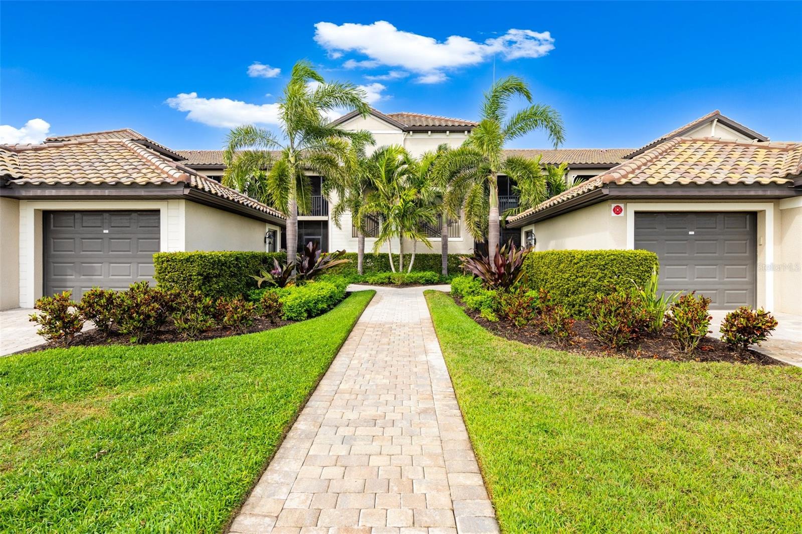 This Condo is Sold Turnkey Furnished minus a few personal items. Luxury living awaits in this stunning condo at Lakewood National in Lakewood Ranch, where breathtaking golf course views and modern elegance come together seamlessly. This bright and airy home features two spacious bedrooms, two full bathrooms, an office/den, and a one-car garage. Designed with an open-concept layout, the living spaces flow effortlessly, creating a perfect environment for both relaxation and entertaining.
At the heart of the home, the gourmet kitchen boasts a large island, abundant counter space, a walk-in pantry, and a separate eat-in area. Overlooking the inviting living room, it provides the ideal setting to take in the picturesque golf course views through expansive windows. The primary bedrooms features 2 walk-in closet and an en-suite bathroom featuring dual vanities and a walk-in shower. An additional bedroom and full bath offer comfort for guests, while the office/den provides flexibility to suit your needs.
lOCATED JUST A SHORT WALK FROM THE CLUBHOUSE AND RESORT-STYLE POOL, THIS CONDO OFFERS THE ULTIMATE CONVENIENCE. Ownership includes full membership to Lakewood National’s two Arnold Palmer-designed golf courses, along with access to world-class amenities such as a heated pool with waterfalls and lap lanes, a poolside Tiki Bar & Café, two on-site restaurants, tennis and pickleball courts, and a state-of-the-art fitness center. A dedicated Lifestyle Director ensures a vibrant community experience with events like trivia and karaoke nights, holiday celebrations, and live entertainment.
Don’t miss this opportunity to embrace resort-style living in one of Lakewood Ranch’s most sought-after communities. Schedule your private showing today and make this exceptional home yours!