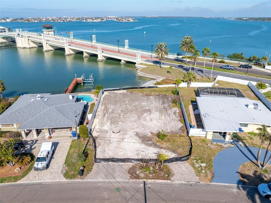 **Waterfront Property in Causeway Isles** Discover a large vacant lot with stunning views of the Intracoastal Waterway and the Treasure Island Bridge. This is your opportunity to build the multistory home of your dreams, surrounded by breathtaking vistas of Boca Ciega Bay, the Gulf of Mexico, and the Intracoastal Waterway to the north and south. The previous home has been demolished, the lot cleared, and it is now ready for you to create your luxury waterfront oasis. Located near the highly sought-after Yacht Club Estates, this boater’s paradise offers deep water access, ideal for accommodating large boats and sailboats. A drawbridge allows for Gulf access to the north, while a fixed bridge provides access to the south. This area is experiencing a significant rebuilding of waterfront estates, presenting you with the opportunity to design and build your custom coastal retreat on nearly a quarter-acre lot. This property is perfect for embracing the Florida lifestyle! The world-famous Gulf beaches are just a short distance away, and Downtown St. Petersburg is a thriving hub filled with a vibrant arts scene, world-class dining, a variety of entertainment venues, and unique boutiques. Inquire today to make your Florida waterfront dream a reality!