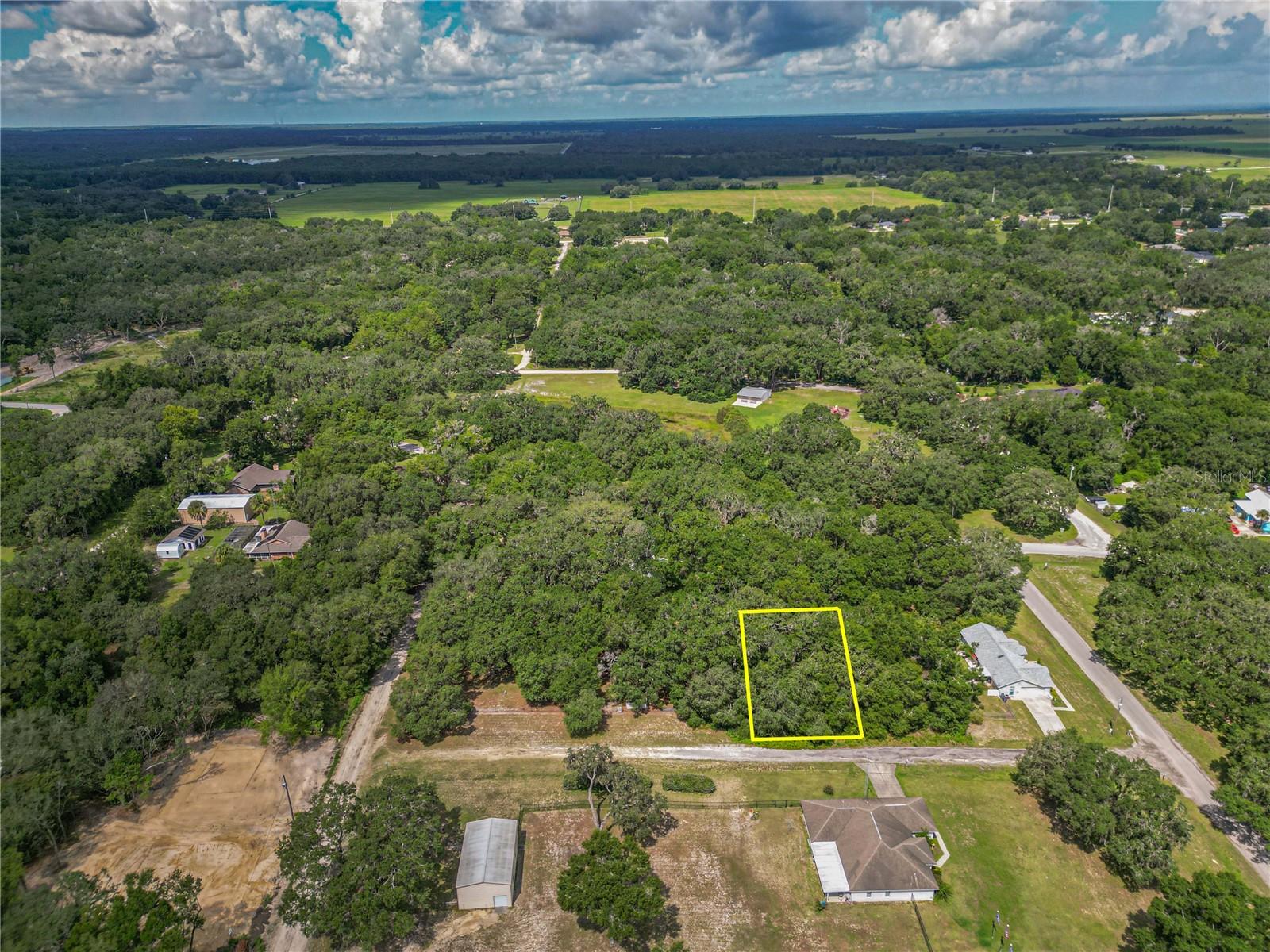 Build your dream home on this beautiful .22-acre lot in the sought-after community of Rolling Ranch Estates, known for its peaceful, rural charm and welcoming neighbors. Enjoy the tranquility
of country living while still being close to everything you need. This homesite offers easy access to Rolling Ranch Park, featuring picnic areas, playgrounds, walking trails, and sports courts.
Just minutes from KP Hole Park and the Rainbow River, you can enjoy tubing, kayaking, paddleboarding, and swimming in crystal-clear waters. Rainbow Springs State Park is minutes away for
hiking and wildlife viewing, with unique shops and waterfront dining nearby. Conveniently located near shopping, dining, and medical facilities in both Dunnellon and Ocala—plus quick access
to Ocala’s renowned equestrian venues—this lot offers the perfect blend of community, nature, recreation, and convenience, all with no HOA.