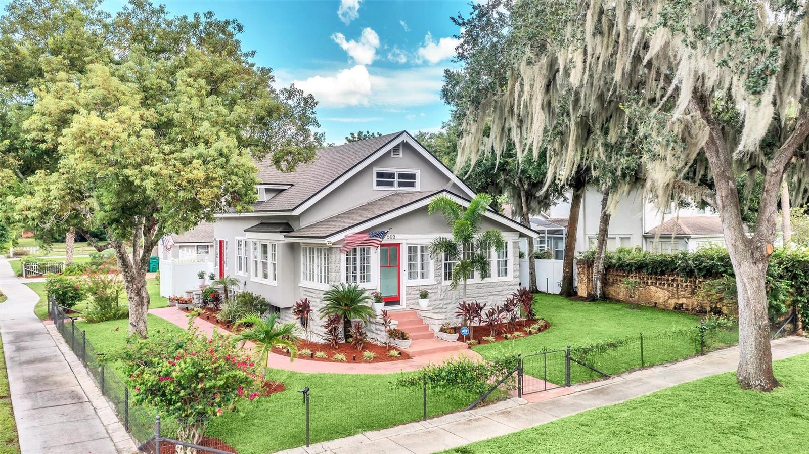 HISTORIC ELEGANCE. You will be instantly charmed by this 5 Bedroom, 3 Bath home and impressed by the welcoming curb appeal. Walk through the front door into a light and bright sunroom entry parlor. As you roam the rooms you will see that there have been many recent renovations and modern upgrades. You will find granite counter tops throughout, upgraded wood cabinetry, laminate flooring, fresh paint, security system, remodeled bathrooms and the roof is only 3 years old. The main floor has the Family room, Dining Room, Kitchen, Laundry Room, Primary Bedroom/Flex space and a Full Bathroom. Upstairs there are 3 Bedrooms and a full bath. This rare gem not only has 2 floors, but also a finished basement which has a living area, bedroom, and full bathroom. This space is perfect for an in-law suite, Master Bedroom, guest room, or teenage paradise. You will have plenty of space for entertaining and enjoying the Florida weather on the large back deck and gazebo in the backyard. Downtown Eustis is short walk and there is plenty of shopping and restaurants close by. If you are a nature lover, Lake County is home to numerous parks, lakes, springs, hiking trails and close to the Ocala National Forest. Currently this property is a single-family home, however, there is an option for some commercial opportunities as it is zoned RT. Don't let this one slip through your fingers, make an appointment to see it today!