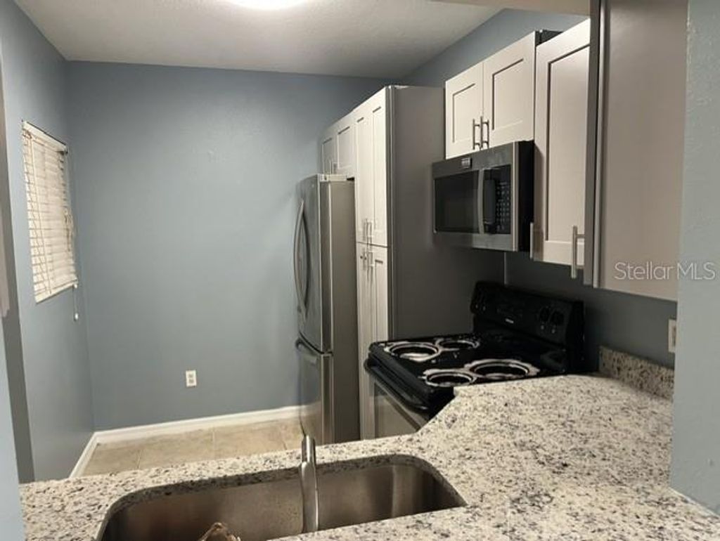 Photo of 495 Las Cortes Lane #102, Orlando, FL 32824 (MLS # S5151894)