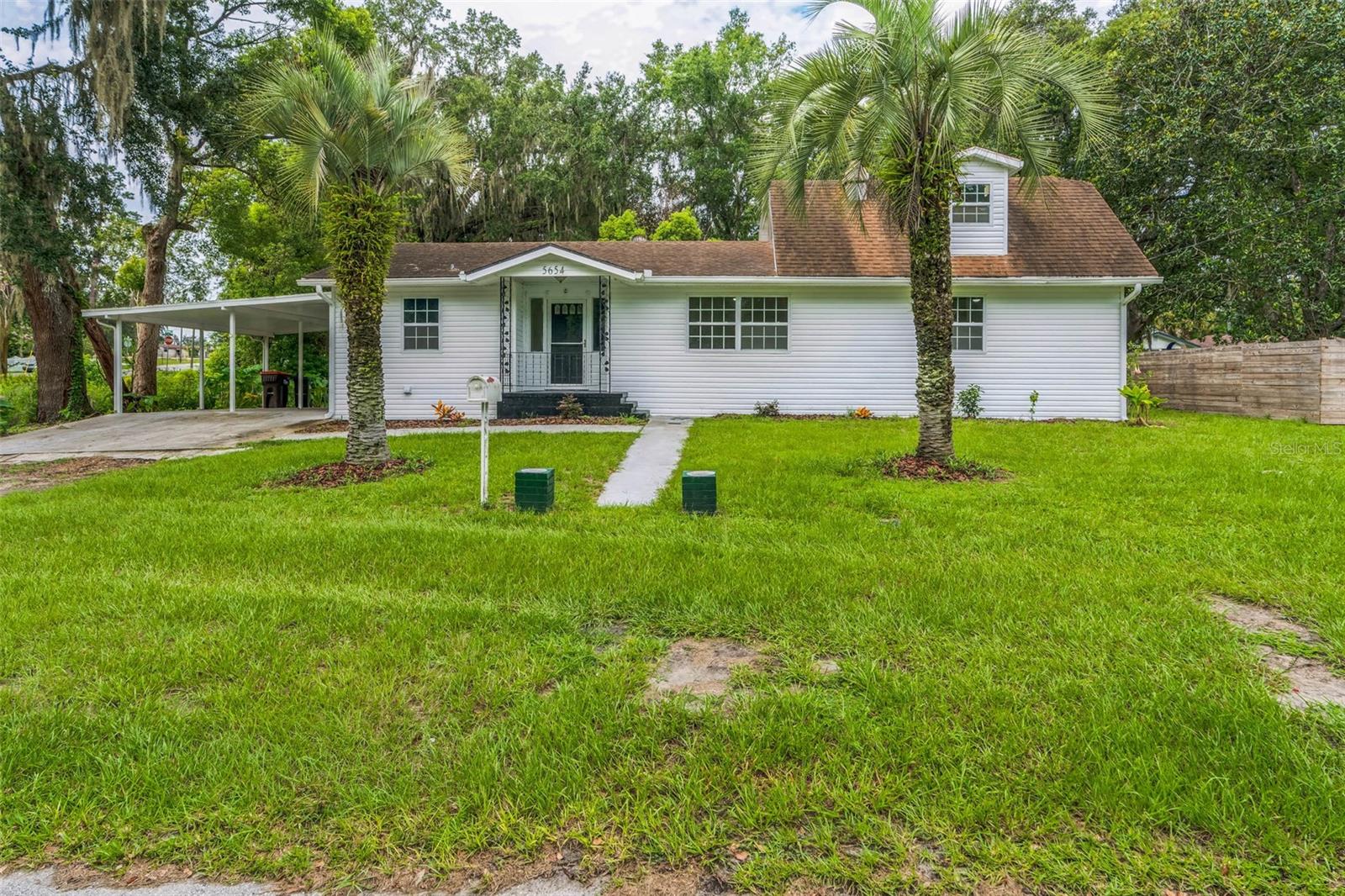 Welcome to 5654 SE Poinciana Rd, a move-in ready 3-bedroom, 2.5-bath home on a large, private, fenced lot in Belleview. This well-maintained property offers a great blend of comfort and updates, including new luxury vinyl wood plank flooring throughout and fresh interior paint. The home features a spacious primary suite with an en-suite bathroom and walk-in closet. Enjoy peace of mind with newer windows, a 2020 AC, updated electrical, and other major improvements completed within the last five years. A huge utility/workshop room provides excellent flex space for storage, hobbies, or projects. Step outside to a large private backyard perfect for entertaining or quiet evenings at home. Conveniently located with room to spread out, this property offers both privacy and practicality! Qualifies for no money down USDA financing! Don't miss out on this opportunity. Schedule a tour today!!