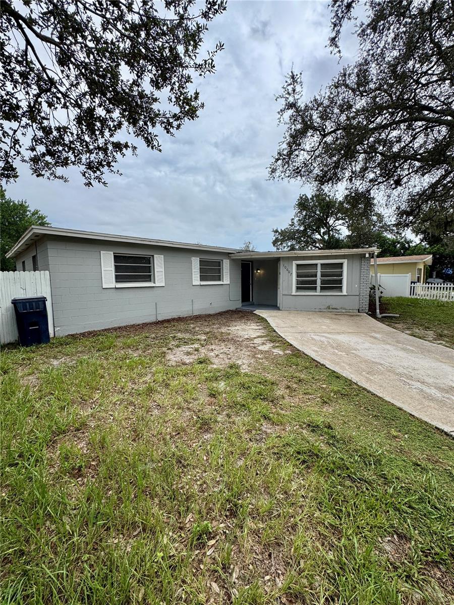 Don't miss out on the opportunity to own this beautifully updated 4 bedroom, 3 bathroom home in North Tampa! This amazing home boasts a freshly painted interior with a mixture of ceramic tile and brand new LVP flooring in the bedrooms for effortless upkeep, a gorgeous kitchen with brand-new granite countertops and stainless steel appliances, 2 separate master suites, brick accents, updated ceiling fans, a great back porch area, and a privacy fenced yard perfect for your furry friends or relaxing after a long day!! AC & water heater replaced in 2024! Convenient to tons of shopping and food destinations, University of South Florida, Busch Gardens, Yuengling Brewery, University Mall (which is undergoing fantastic renovations), I-275, and more!!
