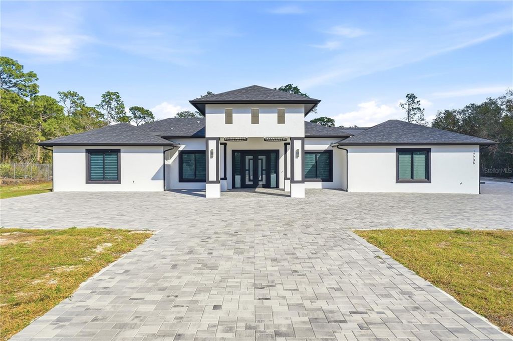 Photo of 17736 Overstreet Lane, Spring Hill, FL 34610 (MLS # TB8479780)