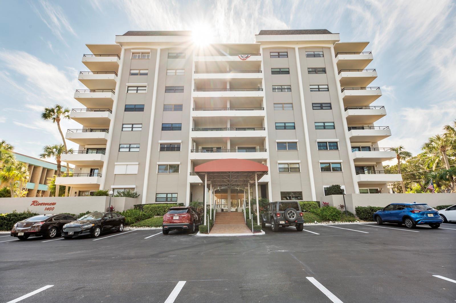 Welcome to the RIVERVIEW condo, a 55+ condo nestled along the picturesque MANATEE RIVER. This exceptional CORNER UNIT condo has recent updates including fresh paint, newer carpet and a newer modern kitchen with granite counters & stainless appliances. This condo also boasts breathtaking water and marina views and an abundance of natural light. For peace of mind, hurricane shutters are on all window openings. The living room and dining room have large windows that provide lots of daytime light to the condo. Sliding doors open to a balcony overlooking the waterfront walking trail along the private and serene setting of the Manatee River. The master bedroom has balcony access, a walk-in closet, and a private bath featuring a walk-in shower. The guest bedroom is separate and very spacious, with a walk-in closet and a private bath through a hallway. The guest bath features a modern vanity and a tub shower. Additionally, there is an oversized BONUS ROOM (7x7) within the unit that can double as office space or additional storage. The building provides a club room, meeting space, and beautifully maintained tropical grounds. Laundry room (free of charge) is next to the elevator. A covered carport space is also included. SECURE building entrance and elevator in the building as well. The Riverview condo is located right on the Bradenton Riverwalk, a five-acre public park that has a 1.5-mile-long walking/biking trail with plenty of green space along the Manatee River. The park offers a skatepark, a 400-seat amphitheater, playgrounds, and a delightful splash pad for recreation and relaxation. Next door you'll find the public library. You are only a short walk to numerous coffee shops, restaurant and bars. The property is close to Sarasota Airport and a 45 minute drive to Tampa International Airport. The pristine gulf coast beaches are only a 20 minute drive away. Please note that this particular property has an AGE RESTRICTION OF 55+ AND ALLOWS NO PETS.