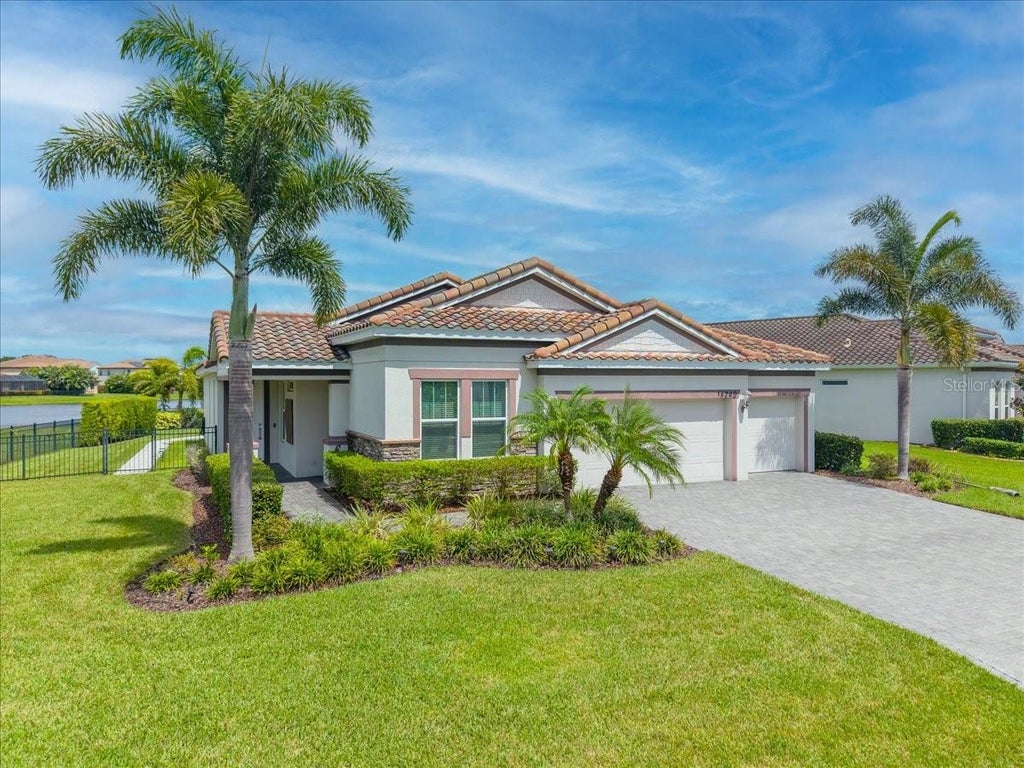 Photo of 13240 Saw Palm Crk Trl, Bradenton, FL 34211 (MLS # TB8547145)
