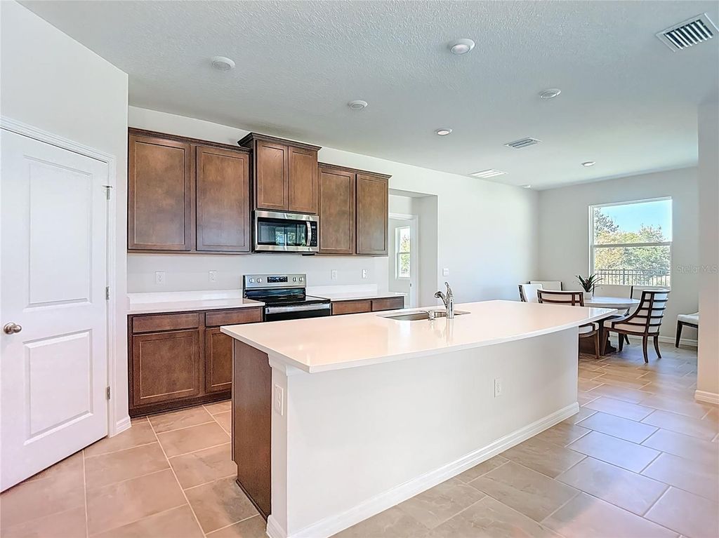 Photo of 10471 Bridgegate Heights Loop, San Antonio, FL 33576 (MLS # TB8445691)