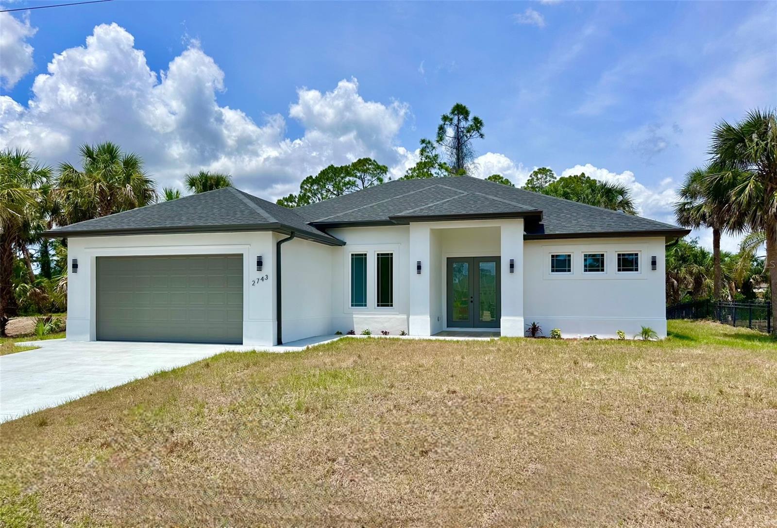 WATERFRONT CUSTOM BUILT HOME! Experience the perfect blend of style, comfort and convenience in this brand NEW 2025 CUSTOM BUILT HOME meticulously crafted to the latest building codes. Boasting over 2,640 square feet of total space this residence embraces 3-bedrooms, 1 office/flex room, 2-baths, and 2 car garage. Ideally situated near everyday essentials, schools, grocery stores, easy access to I-75 for convenient commuting to Fort Myers and Sarasota areas. The welcoming foyer flows into a spacious great room with a cozy electric fireplace, three panel sliding doors provide lots of natural light. 12’ high ceilings in the great room, kitchen and office with modern design and extra recessed lighting. The gourmet custom kitchen impresses with quarts countertops, large waterfall island, tall-double stacked soft-close cabinets, built-in range hood, beautiful tile backsplash, professional appliances, pantry and more. The dining area overlooks the serene waterfront backyard, perfect for starting your day. The primary suit features two panel sliding doors, step ceiling with recess lighting while the ceiling fan providing gentle breeze. Primary bath offers-double vanity, luxurious tile throughout, spacious walk-in shower, two walk in closets, and additional linen closet. Step into the office with double picture windows or make it an extra 4th bedroom to suit your needs. Light and airy combination throughout and contemporary design. Hurricane Impact windows and doors. Inside laundry room with full set of cabinets for extra storage. NO HOA's or CDD's. Enjoy outdoor living under the covered patio overlooking the backyard with plenty of room for the future swimming pool. With its thoughtful design and prime location, this home is a true gem waiting for you to call it your own!