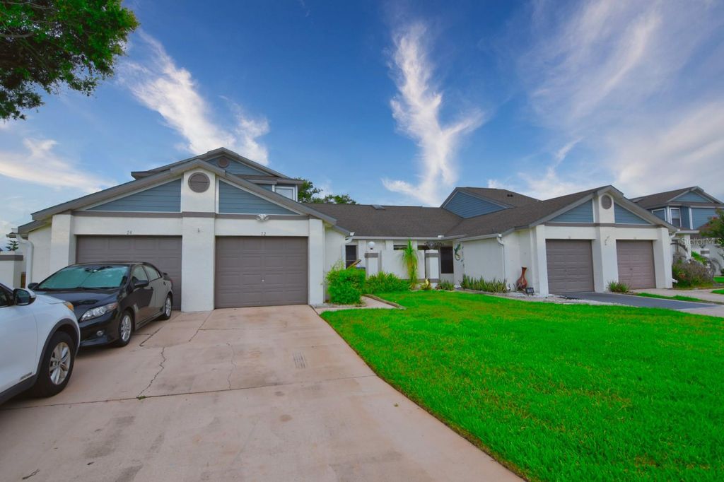 Photo of 72 Lakepointe Circle, Kissimmee, FL 34743 (MLS # O6412111)