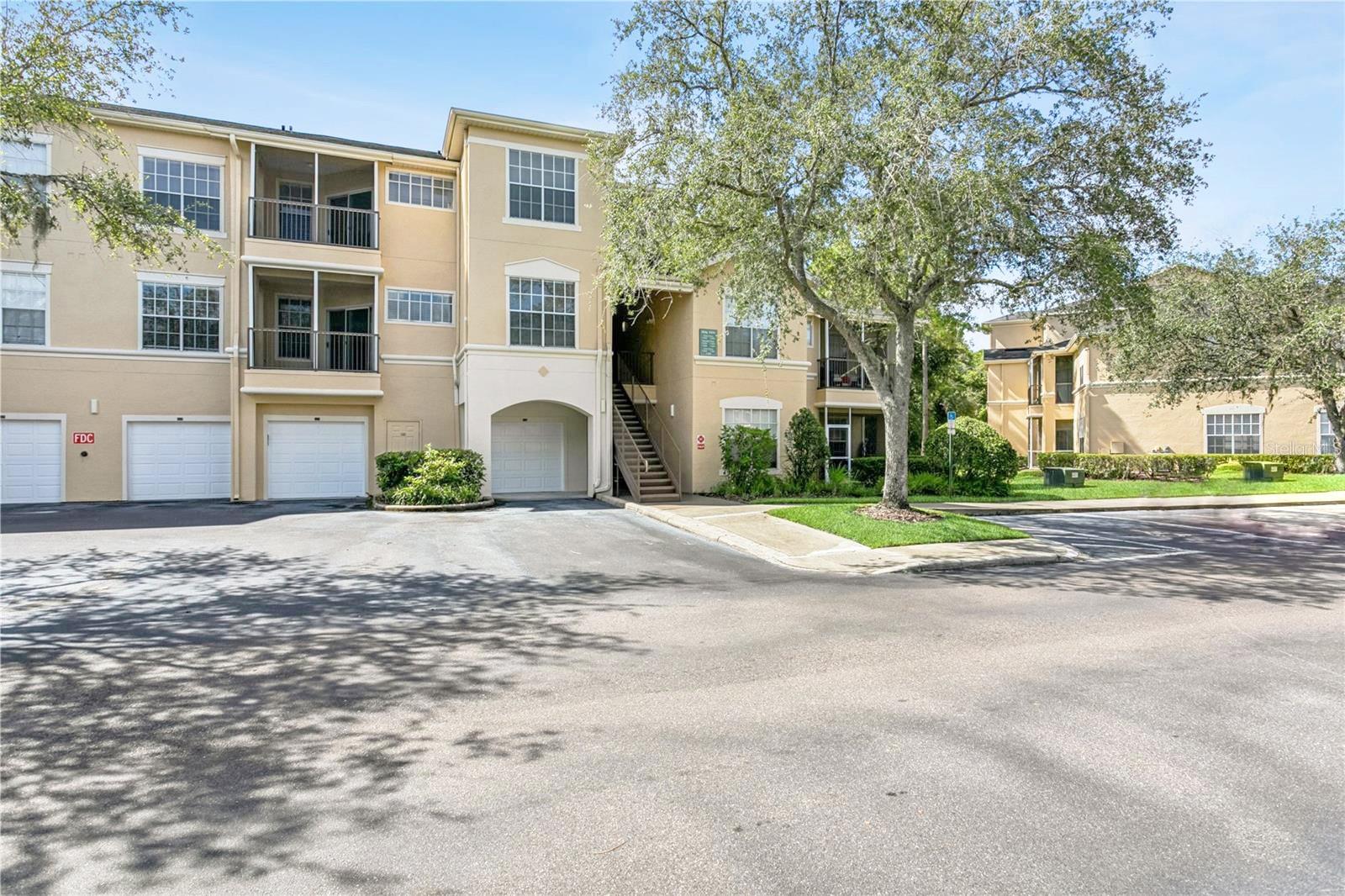 Welcome to Oxford Place at Tampa Palms – a highly sought-after gated community in the heart of New Tampa. This beautifully maintained 2-bedroom, 2-bath condo offers 1,089 square feet of comfortable living space, complete with luxury vinyl plank flooring throughout and a fresh coat of paint, making it move-in ready. This unit also includes a detached 1-car garage, providing both convenience and extra storage.
Step outside your front door and enjoy a resort-style lifestyle. Oxford Place features a sparkling swimming pool with fountains, a fully equipped fitness center, sand volleyball, playground, BBQ grills, dog walking areas, and even a car wash station with vacuum, air, and EV charging. Valet trash service, on-site management, and exterior maintenance are all included for worry-free living.
As a resident, you’ll also enjoy membership to Club Tampa Palms, located just minutes away. There you’ll find three additional pools—including a heated resort pool with waterslide and waterfall—a modern fitness center, tennis and basketball courts, and more.
Perfectly positioned near I-75, this location offers quick access to downtown Tampa, USF, Advent Health, Moffitt Cancer Center, major shopping at Wiregrass Mall and Tampa Premium Outlets, plus miles of trails and golf courses. Tampa International Airport and the Gulf Coast’s award-winning beaches are also just a short drive away.
Don’t miss the opportunity to own in one of New Tampa’s most desirable condo communities. Schedule your private showing today!