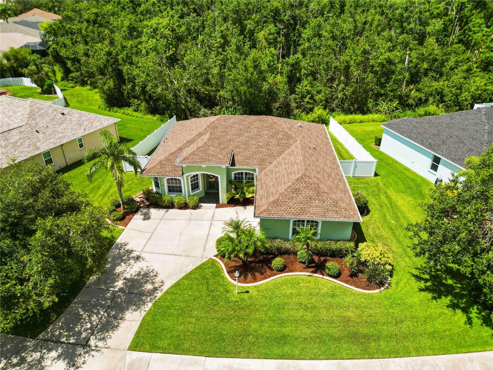 Meticulous 3-Bedroom + Office Home in Gated Chelsea Oaks! Welcome to this beautifully maintained 3 bedroom, 2 bathroom home with an office featuring elegant French doors. The open floor plan is enhanced by high tray ceilings and a formal dining room, creating a spacious and inviting feel throughout. The great room seamlessly extends to the outdoors with double sliding doors that open to a large screened lanai, overlooking a partially fenced backyard and private preserve lot. The kitchen is a chef’s delight with 42” cabinets, granite countertops, custom tile backsplash, breakfast bar, eat-in dining space, and a convenient closet pantry. The split bedroom layout provides privacy, with the primary suite offering a spacious retreat complete with dual sinks, soaking tub, and walk-in shower. For everyday convenience, the interior laundry room is equipped with built-in cabinets. This home has been thoughtfully updated with a new roof (2023), AC (2021), water heater (2022), water softener (2023), washer & dryer (2024), fencing (2020) and comes partially furnished. Located in the gated community of Chelsea Oaks, residents enjoy a community pool, playground, basketball court, and walking trails—all with no CDD fees. HOA fees also include a cable and internet package. Ideally situated near top-rated schools, shopping, restaurants, Ft. Hamer Bridge, and the boat ramp, this home offers the perfect balance of comfort and convenience.