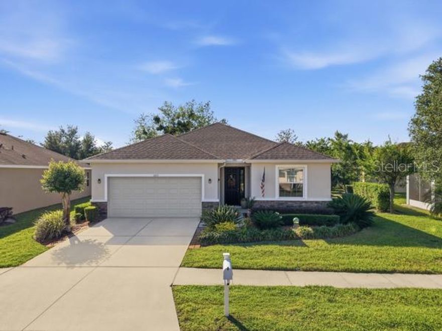 Beautifully maintained 3-bedroom, 2-bath home with over 2,000 square feet of open living space, built in 2015 and located in the highly desirable Summertree community in New Port Richey. From the moment you walk in, you’re welcomed by a bright, airy layout with tile flooring throughout the main areas and a seamless flow between the living, dining, and kitchen spaces.
The kitchen is the heart of the home, featuring granite countertops, stainless steel appliances, abundant cabinetry, a large center island with bar seating, and pendant lighting, all overlooking the spacious living area—perfect for entertaining or everyday living.
The split floor plan offers privacy, with a generously sized primary suite showcasing tray ceilings, a walk-in closet, and an en-suite bath with dual vanities, a soaking tub, and a separate glass-enclosed shower. Additional bedrooms are well-sized, and a versatile flex space provides the perfect option for a home office, den, or playroom.
Step outside and experience your own private retreat—an extended screened-in lanai for relaxed indoor-outdoor living, complemented by a stunning side patio adorned with Roman-style pavers. Surrounded by lush, manicured gardens and vibrant greenery, this space feels like a hidden courtyard—perfect for morning coffee, quiet evenings, or simply unwinding in your own peaceful oasis.
The home also features a 2-car garage, interior laundry room, and beautiful curb appeal with thoughtfully maintained landscaping.
Summertree is an exceptional 55+ gated community, celebrated for its active lifestyle and resort-style amenities. The newly renovated clubhouse features a heated pool, billiards room, card room, computer center, library, and arts and crafts space, along with a full calendar of dances and social activities. Residents enjoy access to a well-maintained, affordable public golf course, and golf carts are welcomed throughout the neighborhood. Surrounded by natural beauty and wildlife, this community offers a rare blend of elegance, activity, and scenic charm.
Conveniently located near beaches, the Suncoast Parkway, and the new Moffitt Center, Summertree is truly a hidden gem of Pasco County.