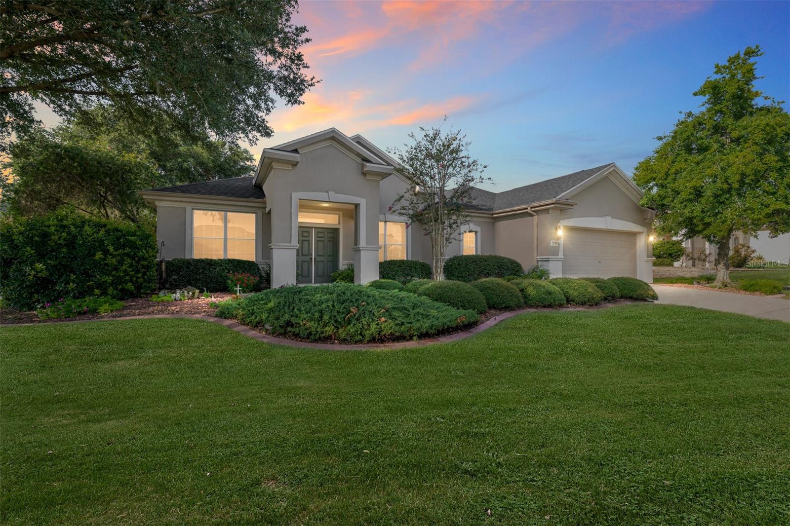 Brand New on the Market – Popular Granville Model with Den, Gourmet Kitchen & Private Backyard Oasis!
This ever-popular 2 bedroom, 2 bath plus den Granville model is one you’ll want to see right away! From the beautifully landscaped front yard to the thoughtfully designed interior, this home blends comfort, function, and style.Step through the twin front doors into a spacious open floor plan featuring a gourmet kitchen with granite counters, tiled backsplash, stainless steel appliances, an island with hanging pot rack, and abundant cabinet space — all overlooking the great room, so you’re always part of the gathering while entertaining.
The great room features solid wood flooring, recessed lighting, and a flexible area perfect for formal dining. Flooring includes tile in the kitchen, bathrooms, and den, with carpet in both bedrooms. The den with French doors makes an ideal office, hobby space, or extra guest room with added privacy. The utility room is currently set up as a large walk-in closet, with laundry relocated to the garage. Additional features include a whole-house water filtration system, new roof (2021), HVAC (2012), re-piped plumbing, and an assumable termite bond.
Enjoy peaceful outdoor living in the screened lanai, which opens to a 10x20 patio covered by a pergola, surrounded by lush landscaping and a variety of plants and shrubs that create a private backyard retreat.Some furniture is available for purchase — inquire for details.
This beautifully maintained home has it all. Don’t miss your chance to own it — schedule your private showing today!