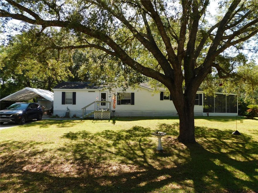 Welcome home to peaceful country living! Escape to the relaxed Nature Coast Florida lifestyle in this charming 3-bedroom, 2-bath home nestled on a generous half-acre lot on a quiet dead-end road. Whether you're looking for a full-time residence, seasonal retreat, or investment opportunity, this home checks all the boxes. The spacious back deck is ready for an above-ground pool or serves as the perfect setting for entertaining family and friends, relaxing with your morning coffee, or enjoying peaceful evenings outdoors. A fenced area provides the perfect place for pets to play, while the detached workshop offers endless possibilities for hobbies, storage, or projects. Conveniently located near great fishing, golf courses, local restaurants, and shopping, this property combines tranquility with easy access to area amenities.