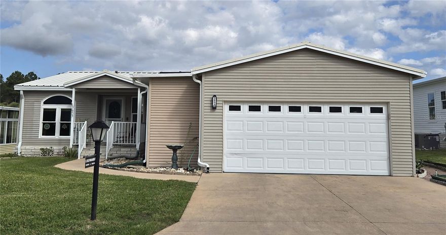 ZELLWOOD STATION GOLF COURSE HOME, 11TH TEE. Triple wide, one owner of this well-maintained 3-bedroom 2 bath home. 2017 metal roof, double paned windows, newer flooring, A/C 2019. 2 car GARAGE with extra workspace and a hurricane shelter you have to see to believe. Large kitchen with plenty of cabinet space and room for a table if desired. Primary bedroom with full bath, double sinks, walk in shower with seat. Also has a versatile bonus room off primary bedroom for office, reading, crafts. Home can remain furnished if desired. Lots of storage, beautiful view of golf course. Everything you could want in a home and more! Zellwood Station is a Resident Owned 55+ Golfing Community located between Apopka and Mt Dora.  We have a 72 Par golf course, 4 pools, pickleball and tennis courts; water exercise and line dancing classes and our own Whistle Stop Restaurant and Lounge with banquet facilities.  There is always something to do here.  Close to the 429 for easy access to airports and attractions, we are close to shopping, restaurants, medical facilities and churches.  Come and see what we have to offer!