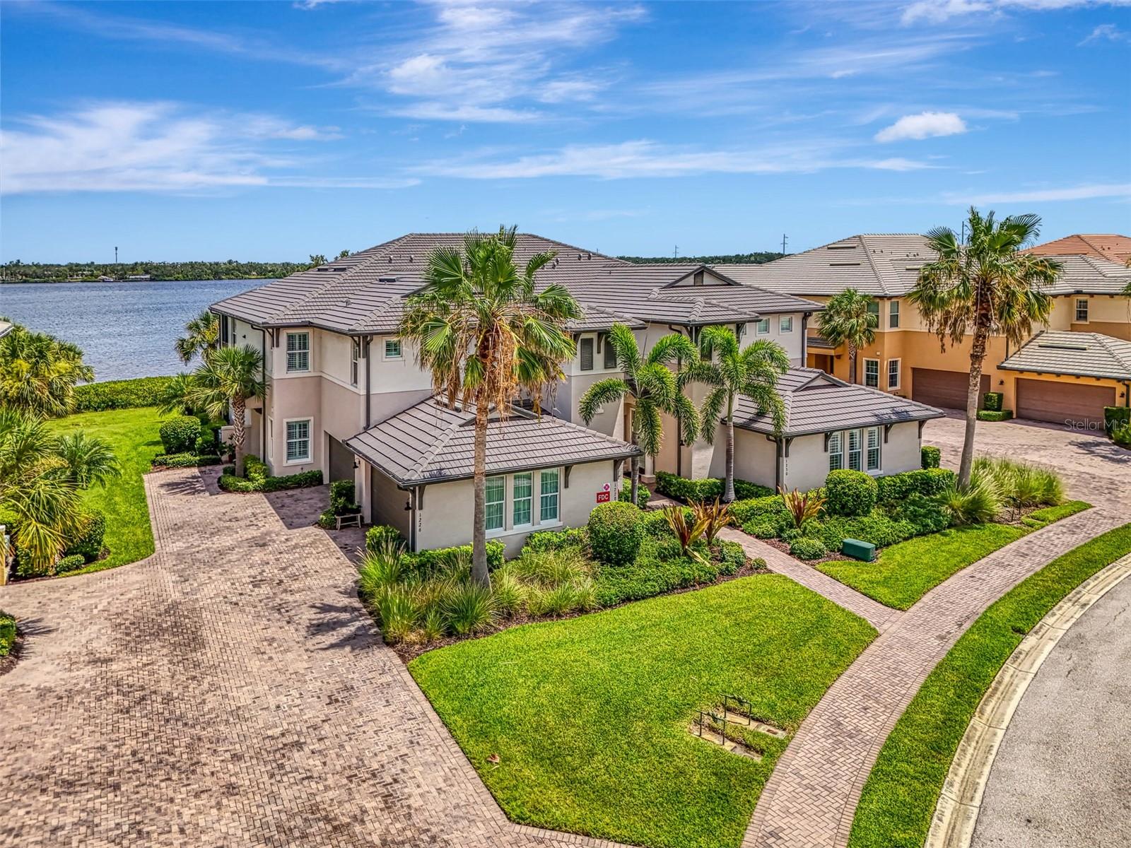 Welcome to the perfect blend of comfort, elegance, and resort-style living. Tucked within a beautifully maintained private home and condominium community, this residence offers exclusive access to premium amenities—including a private marina with river access, two sparkling pools, tennis courts, clubhouses, and a fully equipped fitness center.
Inside, you'll find refined details throughout. From the intricate crown molding and custom millwork to thoughtfully selected lighting and window treatments, every space has been designed with care and sophistication. The formal dining room stuns with a double-tiered tray ceiling and dazzling light fixtures, making it ideal for special gatherings.
The expansive living area offers peaceful views of the Manatee River—just beyond your backyard—while the screened lanai invites you to unwind and take in the natural beauty of the private preserve behind the home.
The primary suite is a private sanctuary, featuring dual walk-in closets, a walk-in shower, dual granite vanities, and a separate water closet. Two additional bedrooms are smartly situated on the opposite side of the home for added privacy, with a beautifully updated guest bathroom completing the layout.
This riverfront gem is a rare find—spacious, stylish, and perfectly located. Come experience it for yourself.