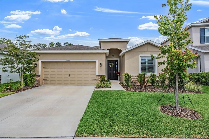 Step into a nearly new home without the wait! Built in 2024, this stunning property shows like a model and is packed with thoughtful upgrades and modern features throughout.From the moment you enter, you’ll notice the elevated details—upgraded lighting fixtures add style and warmth to every space, while plantation shutters provide timeless window treatments. The sliding glass doors are outfitted with remote-controlled coverings, offering both convenience and a sleek, contemporary touch.Designed with both comfort and functionality in mind, the open-concept floorplan creates a seamless flow for everyday living and entertaining. The split-bedroom layout ensures privacy, with the spacious primary suite set apart from the additional bedrooms. A versatile fourth bedroom is currently being used as a bonus room, perfect for a home office, media space, or playroom.The home is equipped with a smart home system for effortless, modern living, along with a water softener for added comfort. The laundry room is fully upgraded with cabinetry and includes a newer washer and dryer.Step outside to enjoy the screened lanai, where you can relax and take in peaceful views of the conservation area and pond—your own private retreat with no rear neighbors. The Deerbrook community offers a community pool, dog park and playground. This home offers the perfect blend of style, technology, and move-in-ready convenience—skip the construction timeline and start living your dream now.