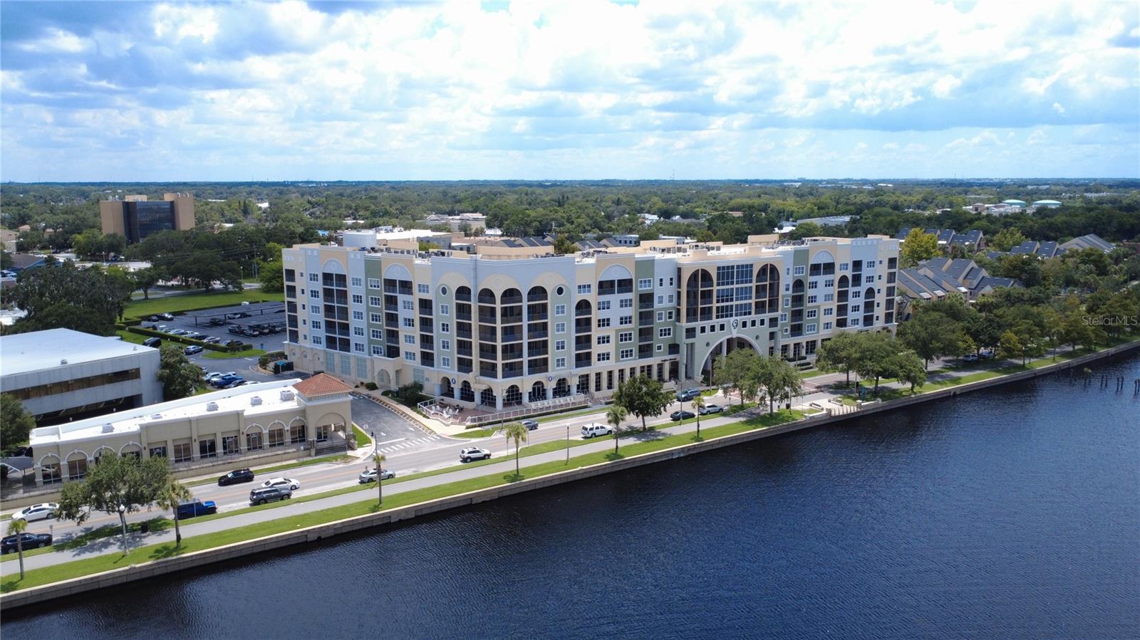 Experience luxury living in the heart of historic Sanford, FL with this beautifully appointed 1-bedroom, 2-bathroom corner-unit condo in the prestigious Gateway at Riverwalk community. Perfectly positioned along the serene shores of Lake Monroe and the St. Johns River, this home offers the ideal blend of comfort, elegance, and convenience—complete with reserved covered parking and exceptional community amenities. Step inside to discover a spacious, light-filled interior featuring an open-concept floor plan designed for both everyday living and stylish entertaining. The living area is bathed in natural sunlight, creating a warm, inviting ambiance, while the chef-inspired kitchen boasts modern appliances, generous counter space, and abundant cabinetry—making meal prep a true pleasure. A rare gem, this corner unit offers two screened and covered patios—one in front and one in back—giving you the perfect spaces to enjoy your morning coffee, curl up with a good book, or unwind while taking in the unparalleled waterfront views. Whether you're watching the sunrise shimmer over Lake Monroe or enjoying a peaceful evening under the stars, these outdoor retreats will quickly become your favorite places to relax. Just steps from your front door lies the vibrant charm of Downtown Sanford. Explore unique boutiques, savor a variety of dining experiences, and stroll along the scenic Sanford Riverwalk. You’re just 200 yards from Henry’s Depot Food Hall, where a curated selection of local eateries and craft beverages await. Enjoy monthly food truck events, visit nearby Fort Mellon Park & Splash Pad, or take in the spectacular 4th of July fireworks and the magical Parade of Lights—all from the comfort of your own community.