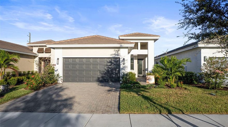 Move-in Ready! Situated in the sought-after 55+ community of Cresswind Lakewood Ranch. The Summerland model showcases thoughtfully designed living with a focus on comfort, style, and effortless entertaining. Enjoy a private backyard retreat enhanced by a beautifully landscaped berm, creating a natural sense of seclusion. The rear kitchen layout seamlessly connects indoor and outdoor spaces, opening to an oversized covered lanai (284+ sq ft) ideal for year-round living. The space is pre-plumbed for a future outdoor kitchen and complemented by a privacy wall perfect for hosting or relaxing. Inside, the home features an enclosed den with elegant double French doors, offering flexibility for a home office or additional living space. The secondary bath has been upgraded with a sleek shower conversion, while all showers throughout the home are finished with tile extending to the ceiling. Wood-look tile flooring flows through the main living areas and den, combining durability with modern style. The kitchen is a standout centerpiece, boasting a dual-island design with a dedicated prep island for enhanced functionality. It is appointed with shaker-style Kitchen Craft cabinetry featuring 5-piece doors, full-extension drawers, and soft-close hardware. Cambria quartz countertops and a designer Emser 3x12 tile backsplash add a refined touch, while GE stainless steel appliances—including a 30” gas free-standing range, dishwasher, and microwave—complete this well-equipped culinary space. Cresswind Lakewood Ranch by Kolter Homes is an exclusive gated community in Lakewood Ranch, Florida, designed for active adults seeking new energy-efficient homes and low-maintenance living. Residents enjoy a pet-friendly environment, scenic walkways, and access to a private lakeside clubhouse with organized activities, flexible event spaces, fitness and yoga studios, and creative art facilities. Outdoor amenities include pickleball, tennis, bocce, resort-style pools, a dog park, food truck court, and social areas. Located in Sarasota/Bradenton, the community offers proximity to beaches, shopping, dining, and cultural attractions, making it an ideal choice for those searching for vibrant, resort-style living on Florida’s Cultural Coast.