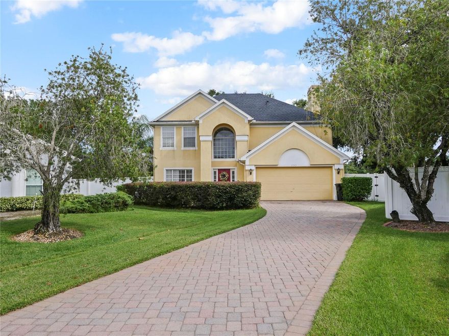 What a true gem in the desirable community of Osprey Landing in Lake Mary! This spacious two-story home features 4 bedrooms and 2.5 baths, situated on an oversized cul-de-sac lot with a long brick-paver driveway. Recent updates include a new roof (2022), new plumbing, fresh interior paint, laminate flooring throughout, ceramic tile in the bathrooms, quartz kitchen countertops, crisp white cabinetry, stainless steel appliances, and ceiling fans in every bedroom. Step inside to a grand foyer with soaring ceilings and natural light pouring through large windows, creating an open and airy feel. The dining room, kitchen, and family room all overlook the fenced backyard—perfect for gardening or outdoor play. The family room features a cozy wood-burning fireplace, while the breakfast nook opens onto an expansive 30’ x 13’ covered patio with brick flooring—an ideal space for entertaining and outdoor cookouts. From the patio, follow the walkway to your private screened tropical saltwater pool, an inviting retreat surrounded by lush greenery. Upstairs, you’ll find all four bedrooms, including the spacious primary suite tucked away at the end of the hallway for added privacy. Located within walking distance of Lake Mary High School and just minutes from shopping, dining, and major highways, this home offers both convenience and lifestyle in one perfect package.