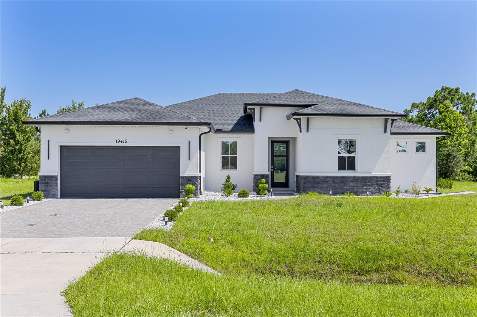 Under contract-accepting backup offers. One or more photo(s) has been virtually staged. Modern, Energy-Efficient Luxury Home on a Spacious 1.17-Acre Lot! Built in 2022 with Paid-Off Solar Panels!
Located with easy access to SR528, you'll enjoy convenient proximity to Orlando International Airport, Lake Nona’s lively dining and shopping options, Florida’s East Coast Beaches, Downtown Orlando, Universal Studios, Disney parks, and more. Plus, the home is zoned for top-rated schools.
Spanning 2,306 square feet, this beautifully designed home features 4 bedrooms, 3 bathrooms, and a 2-car garage. It boasts high 9'4"ceilings and an open, split floor plan. The master suite includes a tray ceiling, a spacious walk-in closet, and a luxurious master bath with dual sinks, a large freestanding soaking tub, and a separate shower with a body shower panel. The home is upgraded with granite countertops, spray foam insulation, 42-inch-high all-wood cabinets with soft-close drawers, recessed lighting, low-emission double-pane energy-efficient vinyl windows and doors, and a stylishly finished garage.
With NO HOA / NO CDD restrictions, you have the freedom to customize this property—bring your RV or boat! Enjoy a serene lifestyle, whether you’re unwinding on your porch, admiring stunning sunsets, or soaking in the spacious outdoor views. This home offers more than just comfort — it’s a lifestyle choice.
The surrounding Wedgefield community boasts excellent amenities, including pickleball, basketball, and volleyball courts, a playground, dog park, baseball field, and walking and exercise paths. Moreover, you have access to the protected Hal Scott Nature Preserve, featuring horse-riding trails, fishing lakes, and camping opportunities.
Schedule your showing today and make this dream house yours!