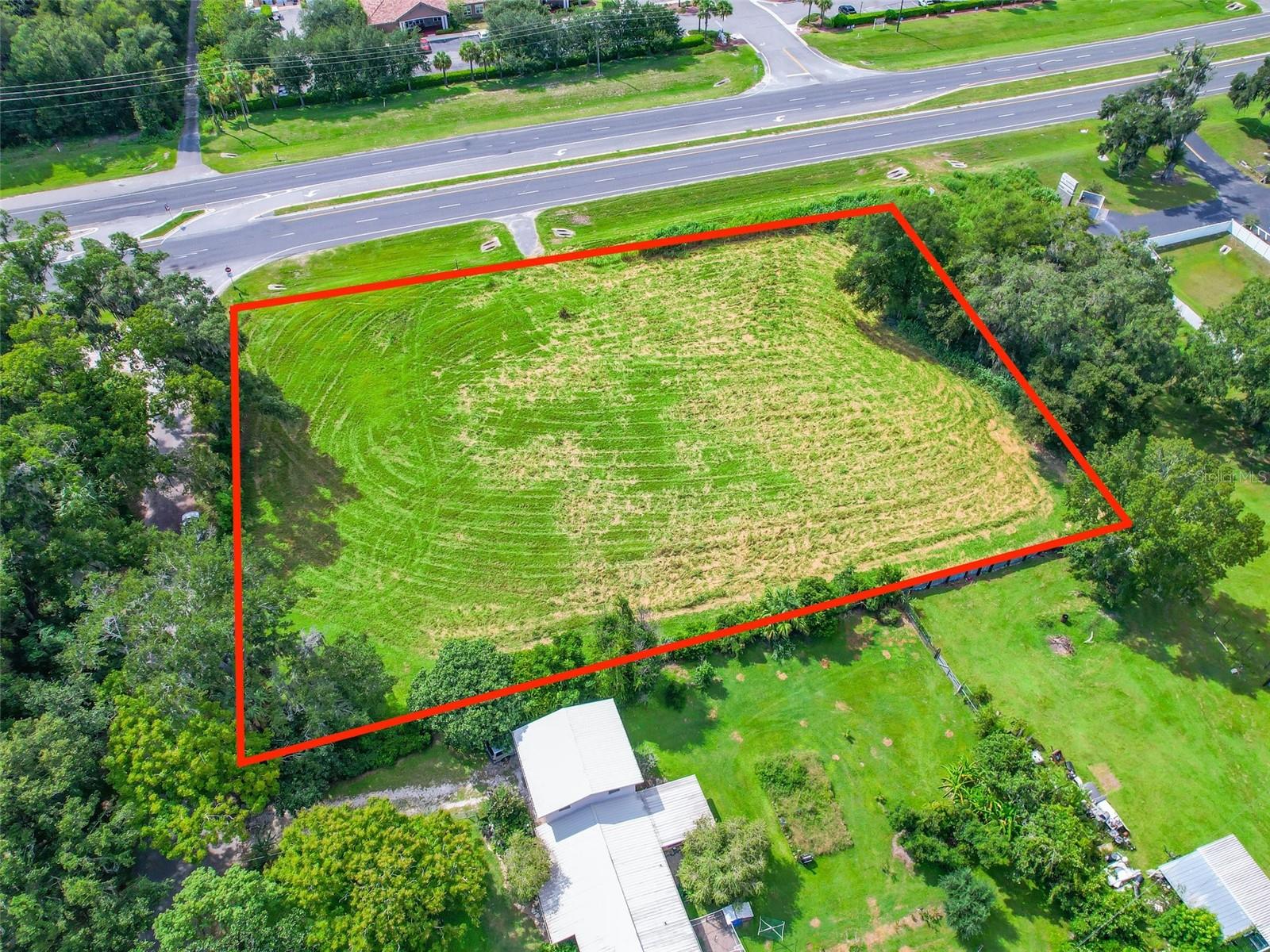 REDUCED - Offered for Sale, Excellent opportunity .59+/- Acre corner directly on US Hwy 301 and CR 110. Zoned C-3, City of Wildwood, City Utilities available, 285'+/- Ft of Hwy 301 frontage and 198'+/- Ft of CR 110 frontage with great visibility, easy access and 26,500 FDOT Avg trips per day.
Site is located near The Villages which is the largest retirement community in the US and surrounded by amazing and continuing growth. This excellent development opportunity has Commercial, Retail, Professional, Medical potential and MORE!! Bring your builder and let's walk the site of your next successful project. All information is believed accurate and correct but not guaranteed or warranted and subject to change without notice.