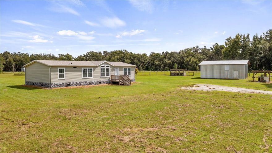 ESCAPE THE BUSY LIFE and check out this amazing Central Florida home and acreage in Sumter County. Right at 10 Acres and a NEW 2021 3/2 beautiful mobile home, 24X36 workshop/barn/storage room, livestock stalls, coop and a 2 car carport. This well maintained home has a NEW upgraded ROOF 10/2024, 2024 Oven, 2023 Refrigerator, 2021 AC, 2021 Well, 2021 Septic, 2021 WH and the Byrd system tie downs making it wind rated to 180mph. You will love all of the extra touches that make it so nice, take a virtual walk through now via this link https://vimeo.com/1126032008 The large 24X36 work shop has a 12X24 room with power and portable AC that makes it great for storage or office or maybe turn it in to an in law suite. Store the vehicles, boats & toys in the large barn and bring all the animals too. On the north of the property you will see the Big Gant Canal, which connects to Big Gant Lake in southeast Sumter County. Webster Florida is best known for one of the states largest flea markets, the Florida Cracker Feed Lot Restaurant but it's also known for it small town rural charm with a close knit community, historical architecture and surrounding landscape of farms and natural spaces. Webster is centrally located making it just over an hour to either the Tampa or Orlando International Airport and an additional 30+ minutes and you can be on a Florida Beach with your toes in the sand. Book your private tour of this home, barn and 9.68 acres today.