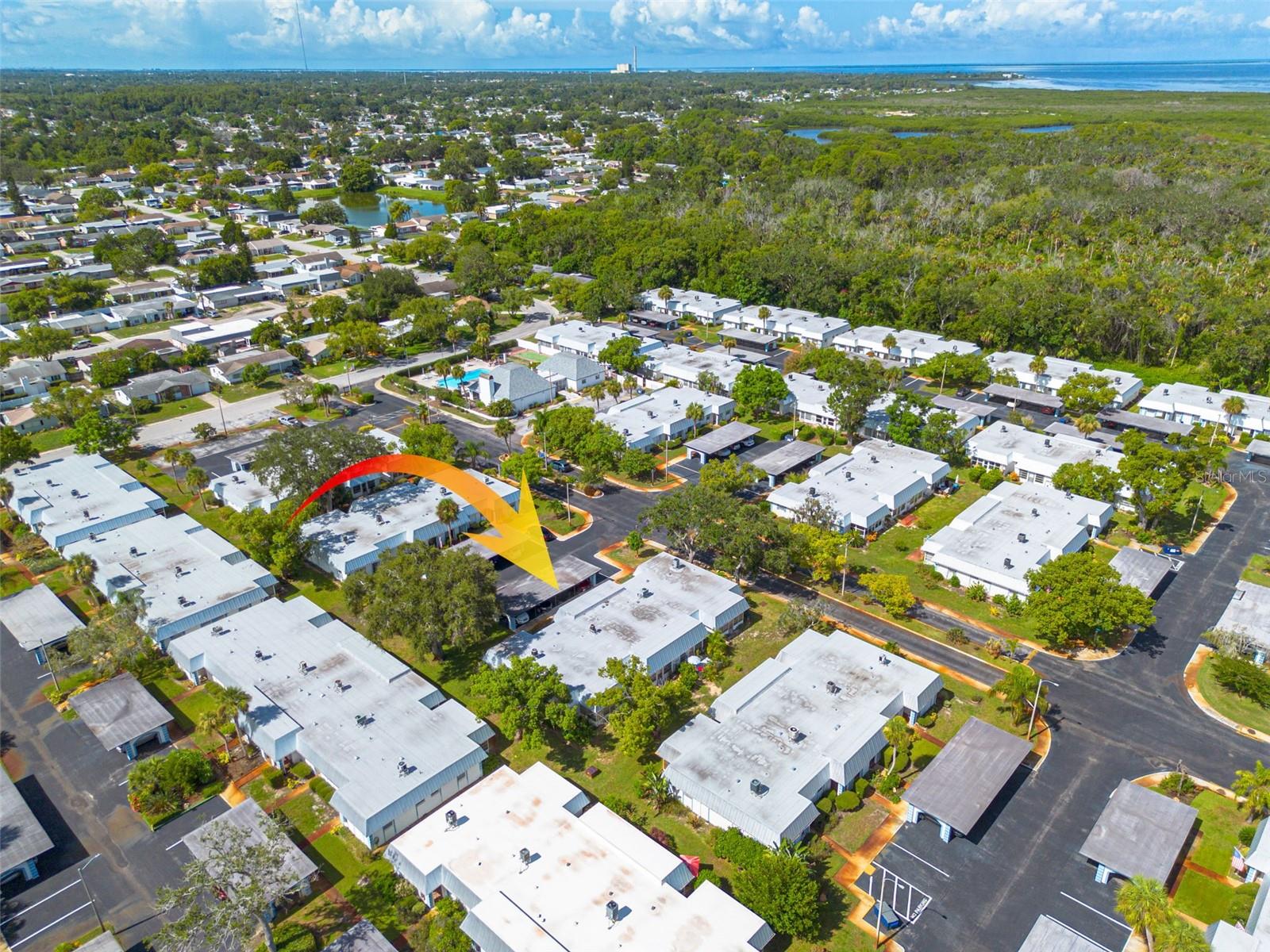Florida Living, Redefined. Discover your slice of paradise in Gardens of Beacon Square, a gated 55+ community where every day feels like vacation. This charming 2-bed, 1-bath home offers sun-filled living spaces, a cozy Florida Room/Sun Parlor, and even your own private patio. With resort-style amenities—pool, clubhouse, shuffleboard, and more—you’ll find not just a home, but a lifestyle. A gracious entryway greets you with elegant tilework, warm tones, and an inviting ambiance that makes every arrival feel like coming home. Picture yourself arriving each day, greeted by a gracious entryway that sets the tone for warmth, comfort, and the simple pleasures of home. The elegant tilework underfoot and the gentle glow of sun-kissed tones promise a sense of sanctuary every time you walk through the door. Each moment here feels like a gentle embrace—a welcome home that soothes the soul. Inside, the home boasts a spacious, light-filled layout enhanced by tastefully updated laminate flooring throughout the living spaces. The kitchen shines with modern appliances and a charming serving window that opens to the living room, creating an airy, connected space for hosting friends or indulging in quiet evenings at home.
The open-concept design flows gracefully, drawing in the Florida sunlight and creating an atmosphere that's both uplifting and tranquil. Every detail has been thoughtfully curated, from the gleaming laminate flooring that moves seamlessly throughout the living spaces to the charming ceramic tilework in your sun-drenched parlor—a space tailor-made for enjoying your morning coffee or slipping into a favorite novel. Imagine preparing delightful meals in your sparkling kitchen, the aroma drifting into the living room through a perfectly placed serving window, connecting loved ones and laughter with effortless style. Evenings flow with ease—host traditions old and new or enjoy a quiet night in, surrounded by comfort and the tranquil energy of your own private retreat. Step into a bright and beautiful FLORIDA ROOM/SUN PALOR bathed in natural light, where elegant ceramic tile floors add a touch of timeless style. This versatile space is perfect for morning coffee, afternoon reading, or quiet reflection. UNIQUE for this community, this unit is outfitted with a WASHER and DRYER, no more laundry room or laundromat! The SUN PARLOR blends charm and practicality, making daily living both effortless and enjoyable.
Delight in the tranquility of a charming outdoor sun porch, beautifully encased with lush flowers and vibrant plants, offering both natural beauty and a serene sense of privacy for your relaxation. What sets this home apart is its blend of charm and practical luxury. Unique among its neighbors, this unit is graciously equipped with an in-home washer and dryer, lending a sense of independence and ease to daily living—no detail has been overlooked in creating a home that feels both indulgent and effortless. With gated security, vibrant community life, and every corner radiating with the loving care of its residents, this isn’t just a place to live—it’s the dream of Florida living, beautifully realized. Here, every day feels like a cherished getaway. Don’t just imagine the lifestyle you deserve—step into it and let Gardens of Beacon Square welcome you home. Schedule your private showing today and experience the best of Gardens of Beacon Square living!