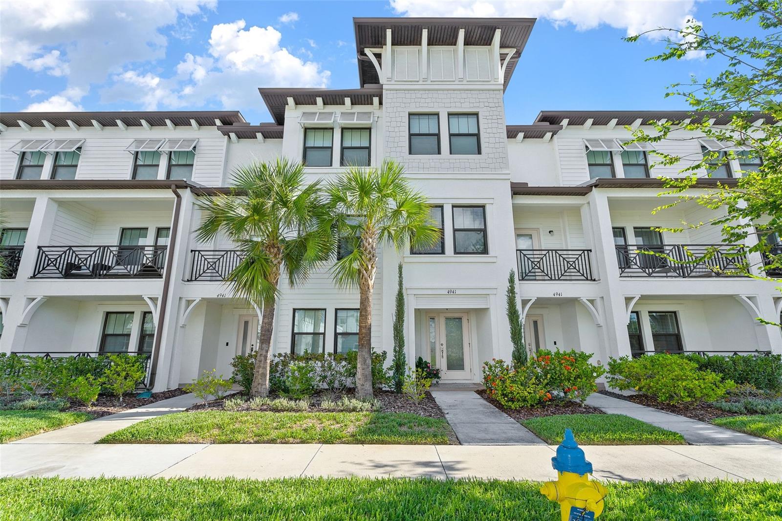 Discover an extraordinary lifestyle in this residence nestled within the sought-after Westshore Marina District. This exquisite south-facing property illuminates every day with abundant natural light, lending warmth and vibrancy to your everyday experience.
Designed for both comfort and style, the residence flaunts the spacious Flagler floor plan, offering four generously proportioned bedrooms and 3.5 well-appointed bathrooms across three well-thought-out levels. The main level features a fully equipped guest suite with a full bathroom, ensuring your guests feel right at home. Garage enthusiasts will appreciate the large two-car garage, boasting ample extra storage space. Additional under-stair storage ensures every nook and cranny of this home is efficiently used. Delight in culinary escapades within a first-rate kitchen, complete with a walk-in pantry, 42" wood cabinets, gleaming quartz countertops, and stainless steel appliances. An expansive island provides the perfect stage for convivial entertaining. Further enhancing the home's appeal are volume ceilings. Washer and dryer are included. The master suite is a retreat in itself, complete with an enormous walk-in closet, making it a sanctuary of style and relaxation. Waterfront lifestyle. Enjoy leisurely strolls to nearby shops, fine dining establishments, and nightlife hotspots. Take your evenings a notch higher with serene walks on scenic sidewalks that thread through the community and along the water. With a prime location close to both Tampa International and St. Pete-Clearwater International Airports, this home is a mere 20-25 minute drive to downtown St. Pete and just 15 minutes from Hyde Park Village.