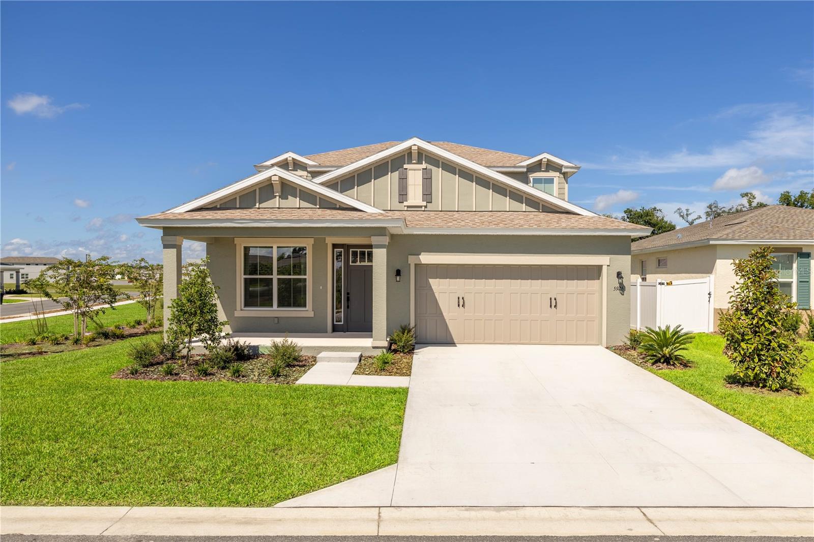 This stunning PRACTICALLY NEW home is located on a corner lot in CALESA TOWNSHIP, one of Ocala’s most sought-after communities. Built in APRIL 2025, this top-of-the-line UPGRADED two-story 2,480 square foot SABLE floor plan with FOUR BEDROOMS, TWO AND A HALF BATHROOMS, an UPSTAIRS LOFT, a FLEX ROOM / OFFICE, and COVERED LANAI is ideal for both entertaining and everyday living! With multiple gathering areas that flow effortlessly -- you’ll be impressed by the exceptional craftsmanship, high-end finishes and elegant, thoughtful design!
A COVERED FRONT PORCH welcomes you home and sets the stage for friendly connections and relaxed neighborhood enjoyment. Inside, a BRIGHT, OPEN FLOOR PLAN unfolds with durable ceramic tile, abundant windows that fill the interior with NATURAL LIGHT, and a timeless classic-meets-contemporary interior that sets the tone for STYLISH LIVING.
The front FLEX ROOM makes an ideal OFFICE, study, playroom or additional seating area, while the spacious living room flows seamlessly to the COVERED LANAI, perfect for outdoor dining or private relaxation. The GOURMET KITCHEN features striking WHITE QUARTZ COUNTERTOPS and STAGGERED CABINETS, STAINLESS STEEL APPLIANCES, and a LARGE PENINSULA ISLAND with bar seating. A spacious PANTRY and adjacent LAUNDRY ROOM add convenience, while the open flow ensures easy connection to dining and living spaces.
The FIRST-FLOOR PRIMARY SUITE is a true retreat, offering a WALK-IN CLOSET, DUAL QUARTZ VANITIES and SINKS, and a GIANT GLASS-ENCLOSED SHOWER. Upstairs, a versatile LOFT provides the perfect playroom, media room, or secondary living room. Three additional bedrooms, each with ceiling fans and ample closet space, share a FULL BATHROOM with DUAL SINKS and a TUB/SHOWER COMBO.
Living in CALESA TOWNSHIP means enjoying unmatched AMENITIES: 22 MILES OF TRAILS (including 10 miles of the Greenway), RESORT-STYLE POOLS, SPLASH PADS, SOCCER FIELDS, BASKETBALL COURTS, PLAYGROUNDS, DOG PARKS, BICYCLE PUMP TRACK, SKATE PARK and COMMUNITY PAVILIONS. Residents enjoy a SAFE GATED COMMUNITY and GOLF CART ACCESS throughout, along with PRIORITY ACCESS to the TOP-RATED on-site INA A. COLEN ACADEMY (K–8 PUBLIC CHARTER SCHOOL) and COMPLIMENTARY FAMILY SWIM MEMBERSHIP at the world-class FAST AQUATIC CENTER with indoor and outdoor Olympic-size pools.
This ALMOST BRAND NEW move-in ready home combines style, comfort, and community living in one of Ocala’s most vibrant and family-friendly neighborhoods –- SCHEDULE YOUR SHOWING TODAY!