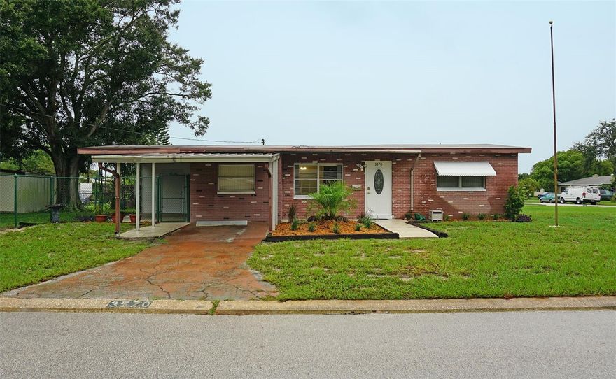 A great house on a double corner lot with plenty of parking and a large fenced in yard. Room for a boat, RV - whatever you need to park. One mile to Tyrone Mall with its surrounding restaurants, shopping and entertainment. This home features an oversized living room and separate den. Inside utility room with extra storage and washer and dryer included. Large covered lanai with attached room that could be a workshop, third bedroom (exterior entrance) or storage room. Large shed in the fenced in area of the backyard. The fence has a double gate. Covered parking on the driveway. Minutes to the beautiful Florida beaches.