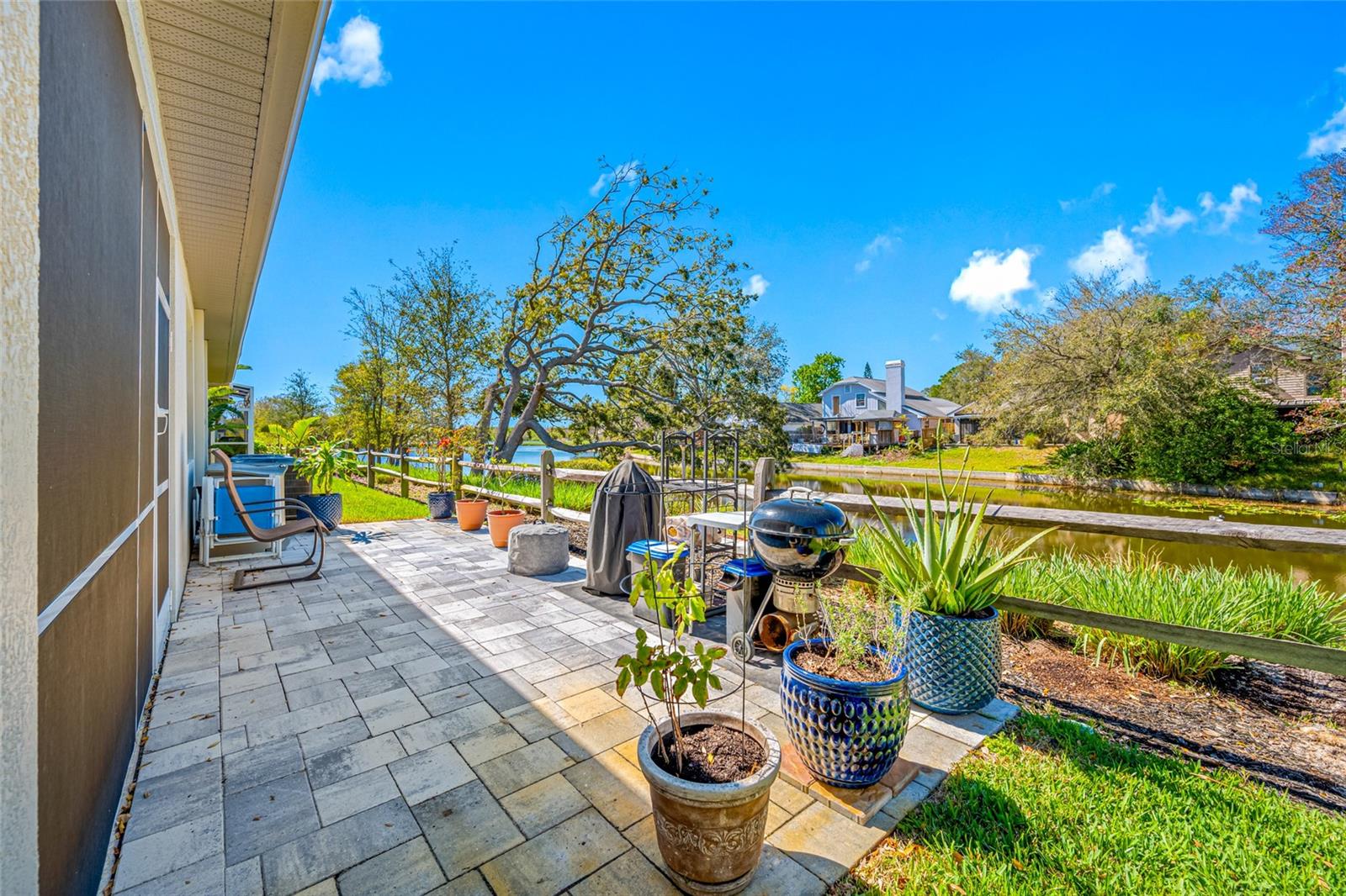 Luxury Waterfront Town Home
Property is also available for sale...see MLS#TB8357413
This stunning town home, built less than four years ago, has every available upgrade! The home features four bedrooms, with the primary suite located on the first floor. The open floor plan invites wonderful gatherings as you and your guests enjoy the gorgeous chef's kitchen which is open to the elegant dining and living rooms. With nine-foot ceilings in every room, this luxury home boasts top-of-the-line tile flooring throughout and carpet in the three upstairs bedrooms. Additional custom, luxury features throughout the home include: quartz countertops in all bathrooms and kitchen, 2021 GE stainless appliances (including 5-burner gas range in kitchen), walk-in closets in three bedrooms, custom cabinets throughout, in-wall pest control system, tankless gas water heater, impact-rated low-E windows throughout, "smart" garage door opener, overhead garage storage racks, security system, and thermostats for temperature control on each floor. The primary suite features a spacious en-suite bath with a built-in shower bench and walk-in closet outfitted with custom shelving and storage.
This tranquil waterfront home is on single dead-end street with only 18 units adjacent to natural, spring-fed Spring Lake, with no neighbors to the front of the house and wonderful views of Spring Lake from all windows and doors at the back of the home. The backyard includes a private screened-in patio with additional privacy shades and a 20’ X 10’ paved outdoor patio, extending your living space beyond the backdoor.
Your HOA fee includes: roof replacement, exterior painting, subterranean termite protection, maintenance of all landscaping on property, lawn irrigation and maintenance, street lighting, road and pond maintenance.
Close to downtown Dunedin with all its shops, restaurants, marina and famous Honeymoon Island Beach! Other nearby features include Pinellas trail, Countryside Mall, Blue Jays Baseball stadium, and Clearwater Beach. Especially exciting is the Gladys E. Douglas Preserve, which is a 44-acre park across from the entrance to the Towns at Spring Lake community. The Preserve is planned to include a Fishing Pier, a Kayak Launch with access to the 55-acre lake, and additional trails coming soon (read about the Preserve online at https://www.dunedin.gov/Activities-and-Recreation/Parks-Recreation/Parks-Playgrounds/Gladys-E.-Douglas-Preserve). AS SEEN ON ABC AND HULU LIVE. Special Feature : Assumable 2.25% interest rate loan. Make your appointment to see this desirable home today, don't miss out!