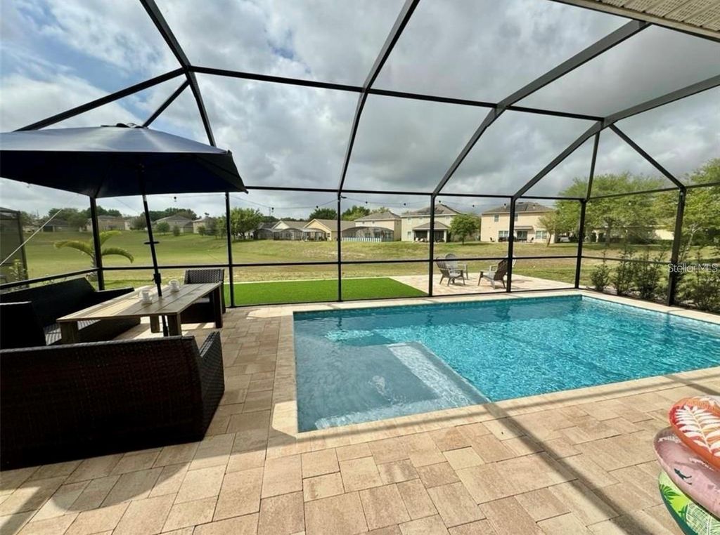 Photo of 1051 Andalusia Loop, Davenport, FL 33837 (MLS # TB8436962)