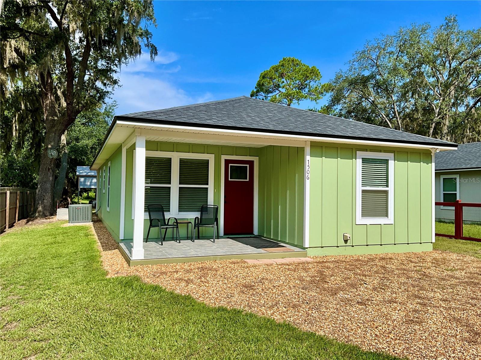 Rare opportunity on the Santa Fe Canal! This fully furnished, turn-key 3 bedroom, 2 bath home was built in 2022 and offers 1,168 heated/cooled sq ft with an inviting open-concept layout perfect for entertaining—inside or out. Enjoy a coastal-inspired interior featuring luxury vinyl plank flooring, granite countertops, shaker cabinets, refrigerator, stainless steel range and hood, and a spacious kitchen bar that flows to the patio and backyard with 2 car carport. The split-bedroom plan includes a primary suite with walk-in closet, barn door, and sleek en-suite bath with glass walk-in shower. Brand New washer/dryer convey. Outside, a fully insulated 10x10 shed with power and HVAC provides flexible storage for a deep freezer and more! With direct canal access and a new fishing pier on the canal which accesses Lake Santa Fe—one of Florida’s most stable, spring-fed lakes—you’ll enjoy year-round boating, fishing, and water fun. Also features front and back motion lights and there is a night time security light by the road. Schedule your tour today!