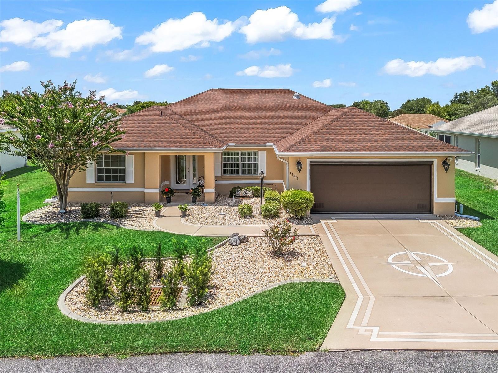 STONECREST is a 55+ gated golf course community with all the amenities and 4 pools (one indoor), and just a Bridge Away By Golf Cart To The Villages! Exceptional Upgraded 3/2 Captiva with a 2 Car Garage, High Efficiency Rheem HVAC 2024, High Efficiency Water Heater 2024, ROOF 2019! This Impressive home boasts Tremendous curb appeal featuring a Designer Driveway and Walkway, New Low Maintenance Professional Landscaping, New Mailbox, Newly Powerwashed & Painted (June 2025), and Covered Front Entrance with Elegant Leaded Glass Front Door! You will Love This Open Concept and Split Floor Plan, with plenty of Space, and Natural Light, making the Captiva model just perfect for Entertaining Friends and Family! This well appointed home boasts New Designer Light Fixtures, Remodeled Kitchen, Vaulted ceilings, Newer Luxury Vinyl Plank flooring, Updated bathrooms, and an Enclosed Lanai with Tile flooring! As you enter into the foyer you are greeted by the Open Concept floor plan, and a lovely Dining area to the right with an Upgraded Designer Light Fixture, and Glowing Laminate flooring. The Spacious Eat in Kitchen showcases Quartz countertops, Stone backsplash, Striking New Black Stainless appliances, 2 Solar tubes, Wood cabinetry with pullouts, Large Stainless Sink & Faucet, New Remote Ceiling fan, Breakfast bar, Eat in Area with Built-In Cabinetry featuring a Quartz countertop, and Sliding door access to the Lanai! The kitchen flows to the Living and Dining area (Living area with a New Remote ceiling fan & Dining area with New dimmer switch), which offers an exceptional space for enjoying comfortable living, and entertaining! The Split Floor Plan offers maximum Privacy for both the Owners & their Guest, with the Primary suite commanding one side of the home while the guest bedrooms and guest bathroom are located on the opposite side of the home. The Primary suite offers Private access to the Lanai, 2 Walk in Closets with Built-Ins, a New Remote LED ceiling fan, and an En Suite bathroom. The En Suite Bathroom features 2 Granite topped Vanities with New Faucets, a Soaking Tub, Walk in Shower, and a Private Water closet! The 2 additional bedrooms feature built in closets, and Bedroom 3 offers a Built in Murphy Bed! The Guest bathroom showcases a Walk in Jacuzzi Tub & Shower, and a Granite Topped countertop with a New Faucet! The Expanded Enclosed Lanai creates a Fantastic Additional living space with Sliding windows, Roll Up Shades, Heavy duty exterior door, 3 ceiling fans with Light package, & a Hygrometer to ensure the humidity level remain in balance. The Lanai is just perfect for enjoying outdoor dining, beautiful Florida Sunsets, and Tropical breezes! You will love having plenty of room for storage in the 2 Car Garage with freshly painted floor, Remote control retractable screen door (2023), Newer Key Pad for Garage entry, all New shelving & Pegboard with hangers! The attic over the garage has New decking providing extra storage space! Stonecrest is a 55+ gated golf course community with all the amenities, pools, pickleball courts, softball, 18 hole championship golf course, Broad Stripes Golf & Social Club & over 80 different clubs to join! It is a community with Private Roads and 24 Hour Security! This home offers approximately $100,000 in Upgrades, Luxurious features, a Desirable location, and a Secure community setting. A WONDERFUL LIFESTYLE AWAITS YOU IN