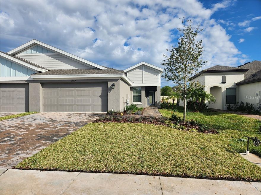 Beautiful, newer villa located in the highly sought after Crosswinds Pointe community in Parrish. The home features an open-concept floor plan with luxury vinyl plank flooring throughout the main living area and carpet in the 3 bedrooms, complemented by high-end cabinetry and elegant stone countertops. The modern kitchen is equipped with stainless steel appliances, perfect for everyday living and entertaining. Offering a true three-bedroom layout, the home boasts high ceilings, a spacious walk-in pantry, and a dedicated laundry room for added convenience. Enjoy Florida living at its finest from the screened lanai, ideal for relaxing year-round. An attached two-car garage provides ample storage and parking. The community pool is conveniently located just across the street, making it easy to enjoy resort-style amenities. Don't miss the opportunity to make this exceptional home yours!