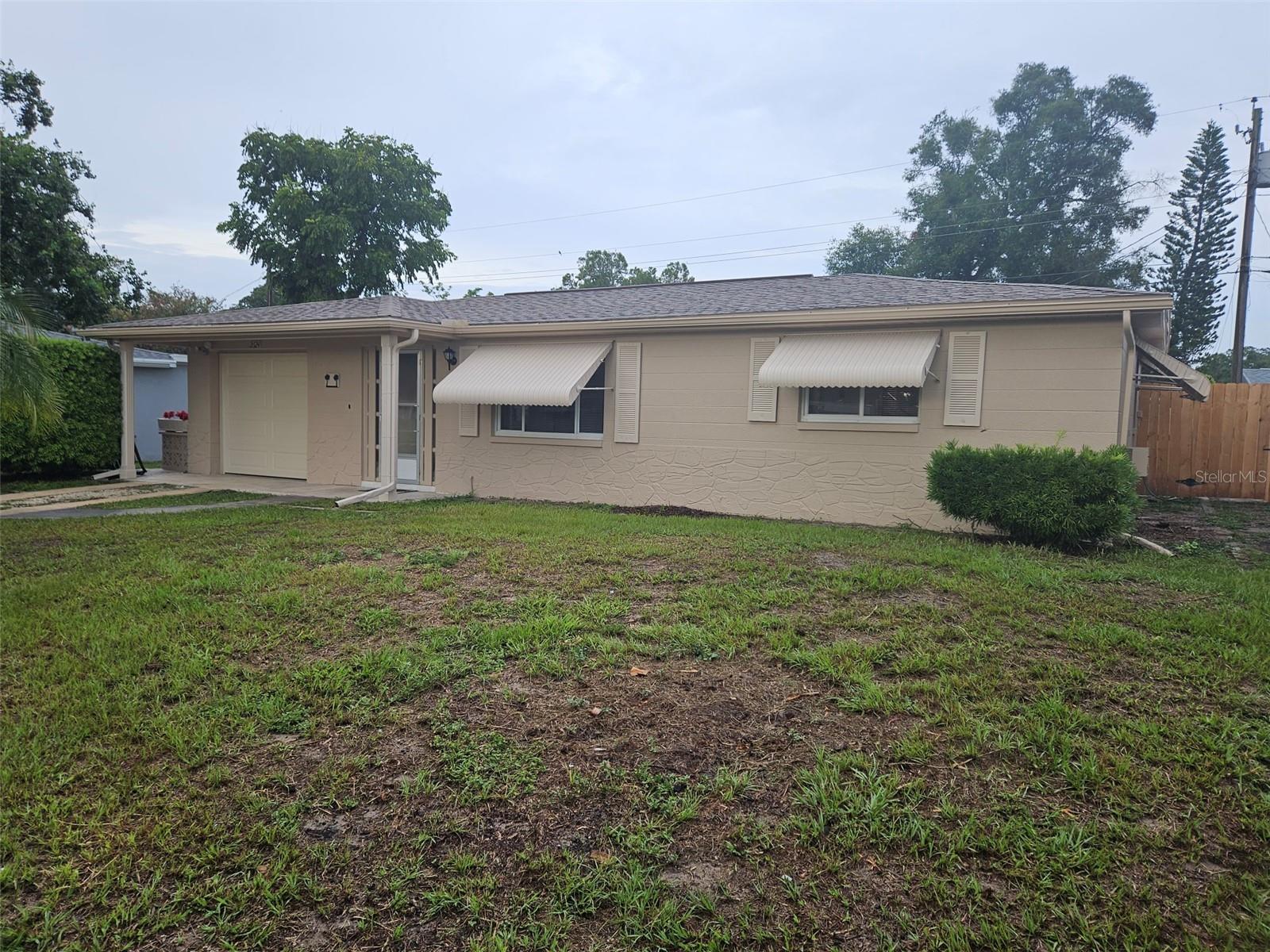 Take a look at this clean, ready to go 2 bedroom, could be 3 bedroom, 1 bath home located in Holiday. Featuring a living room, dining room, NEW kitchen, NEW appliances, painting, NEW floors, and more! Home has recently been painted outside, new HVAC system, fenced yard. 2 enclosed porches, 1 under heat and air that can be used as an office/den/extra room, the other an enclosed porch to enjoy a nice sip of coffee or a book to year. The fully privacy fenced yard adds to a nice private feature while being close to local amenities. Washer and dryer located in the garage for your use. Tenants are obligated to pay $55.00 per month without demand as additional rent for the resident benefit package. Contact us today for a showing of this beautiful home.