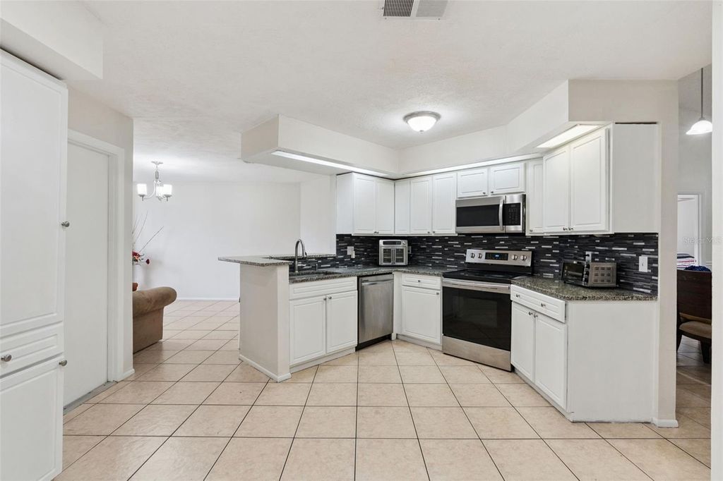 Photo of 932 Ocala Woods Lane, Orlando, FL 32824 (MLS # O6400176)