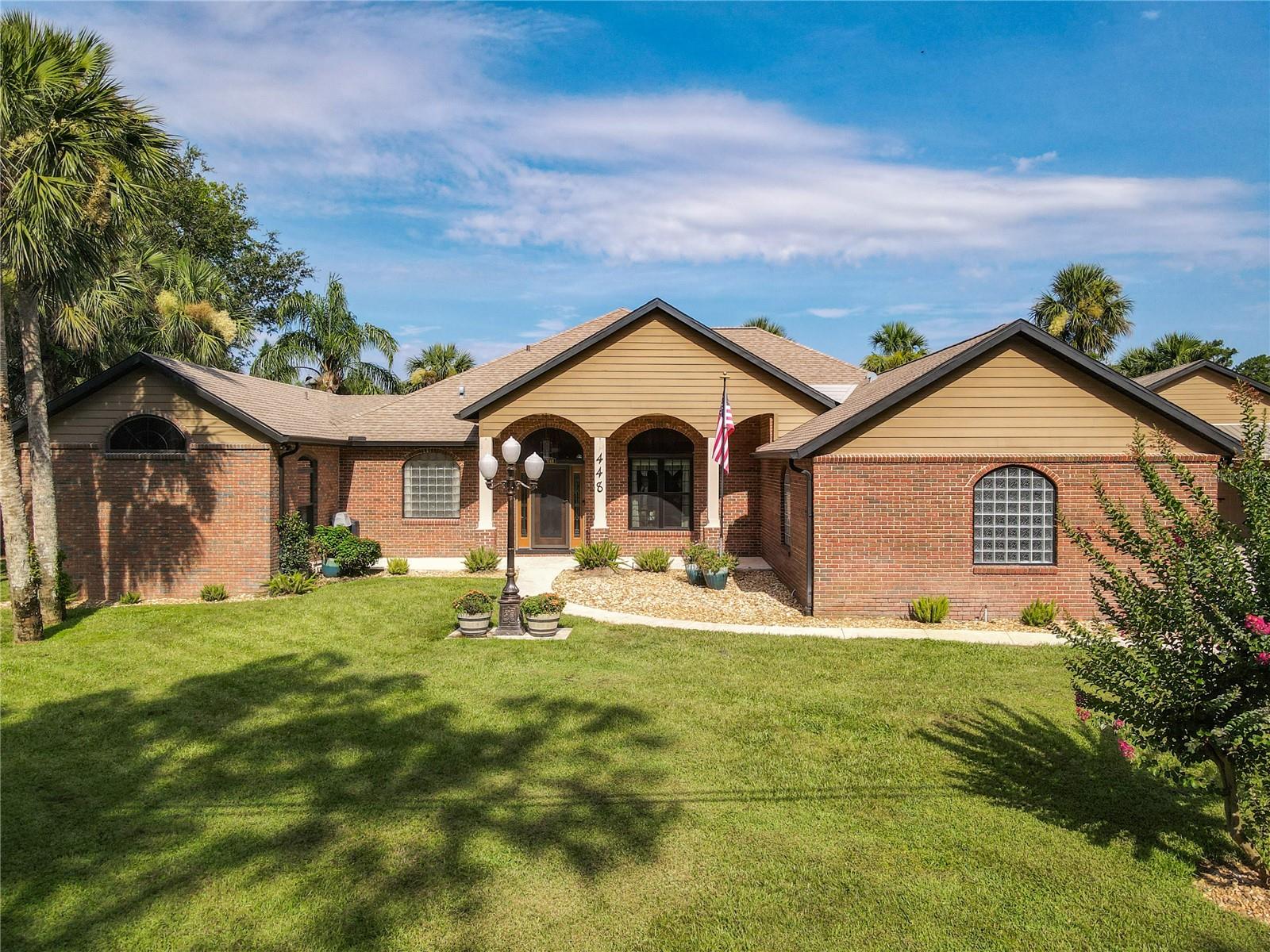 Florida Dream Home sits on a half-acre on Canal leading to St Johns River and Lake Monroe. You’ll love this four bedroom, three bath home in immaculate condition that offers the best of Florida living and is great for entertaining. When you open the front door, you have a great view through the living room with French doors to pool, patio, canal and green space on the other side of the canal. The living room, master bedroom and kitchen have doors that lead to the patio and heated, saltwater, screened sports pool. The dining area is in the front of the home in front of the fully equipped kitchen with granite counters, a breakfast area with views and a large pantry. The family room has a brick gas fireplace and a big window with great views. The master bedroom opens on to the pool & patio plus has a window seat. On the other side of the home are two more bedrooms and a bath plus another bedroom upstairs with its own bath and a balcony over-looking the pool and canal. Other extras include No HOA, high ceilings, crown molding, Pella Windows, 2 water softeners, fenced yard, large laundry room with cabinets and counters, large storage room, 2 AC systems (one a mini-split AC system), irrigation system, lots of pavers, a nicely manicured back yard, a 49x16 boat house with a boat lift, a concrete seawall, a heated, saltwater sports pool with 2 story lanai, four automatic retractable Sun Setter awnings, a 22kW Generac whole-house generator, two car garage with door screen, plus a detached 23x24 garage with 12-ft walls & electric motor home hookup, newer 6” reinforced driveway perfect for a Class B motorhome. Stone Island is golf cart community, residents enjoy access to horse stables, pickleball and tennis courts, and a boat ramp on Lake Monroe and the St. Johns River. Stone Island is in historic Enterprise across Lake Monroe from Sanford. If you like to explore by boat this is the place for you. The St. Johns River is connected to 14 lakes, several springs and many parks. Bring your golf cart & boat and live the Florida Life!
Property may be under video/audio surveillance.