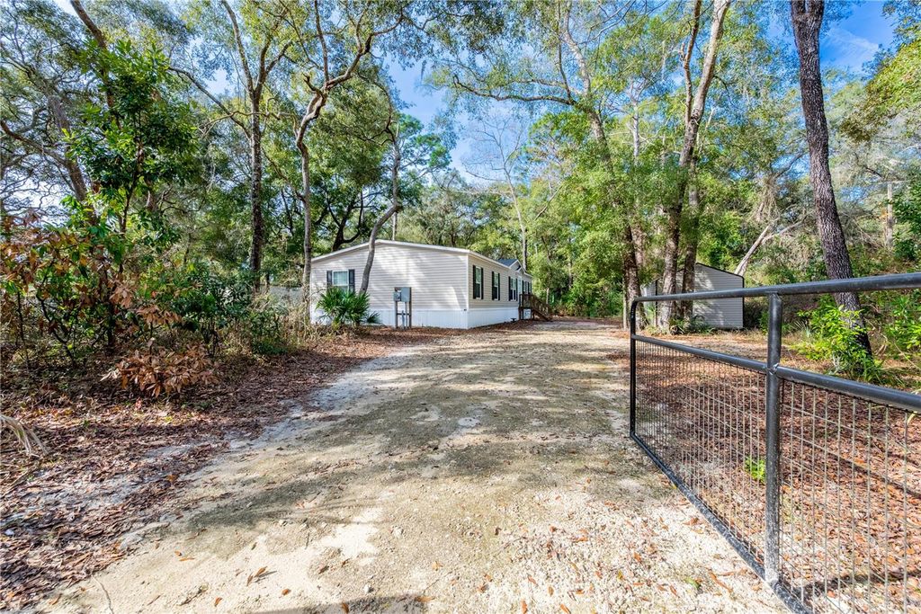 Photo of 11120 NW 107th Terrace, Chiefland, FL 32626 (MLS # GC536452)