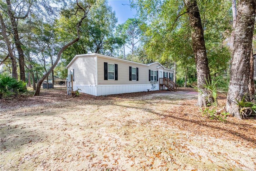 ?? Practically Brand-New 2021 Home on Nearly Half an Acre – Fully Fenced & Move-In Ready

This well-maintained 2021 manufactured home offers modern comfort, thoughtful upgrades, and a peaceful rural setting just off Camp Azalea Road in Chiefland. Situated on a fully fenced 0.46-acre lot, the property provides space, privacy, and flexibility for everyday living.

Inside, you’ll find a spacious 4-bedroom, 2-bath layout with an open-concept design centered around a large granite kitchen island—perfect for cooking, gathering, and entertaining. The home has been carefully maintained and includes quality finishes throughout.

Outside, the property continues to impress with underground utilities, a water softener system, mature citrus trees, and a 12x20 storage shed for tools, hobbies, or extra storage needs. The fenced yard offers plenty of usable space for pets, gardening, or outdoor enjoyment.

Located just minutes from Manatee Springs State Park, the Suwannee River boat ramps at Camp Azalea and Clay Landing, and the Chiefland Golf & Country Club, this home offers convenient access to some of the area’s best outdoor recreation while still being close to town amenities.

Highlights:

2021 built home – move-in ready condition
4 bedrooms / 2 bathrooms
Open floor plan with granite kitchen island
Fully fenced 0.46-acre lot
Underground utilities & water softener system
12x20 storage shed included
Minutes to springs, river access, golf, and town

A great option for anyone seeking modern living