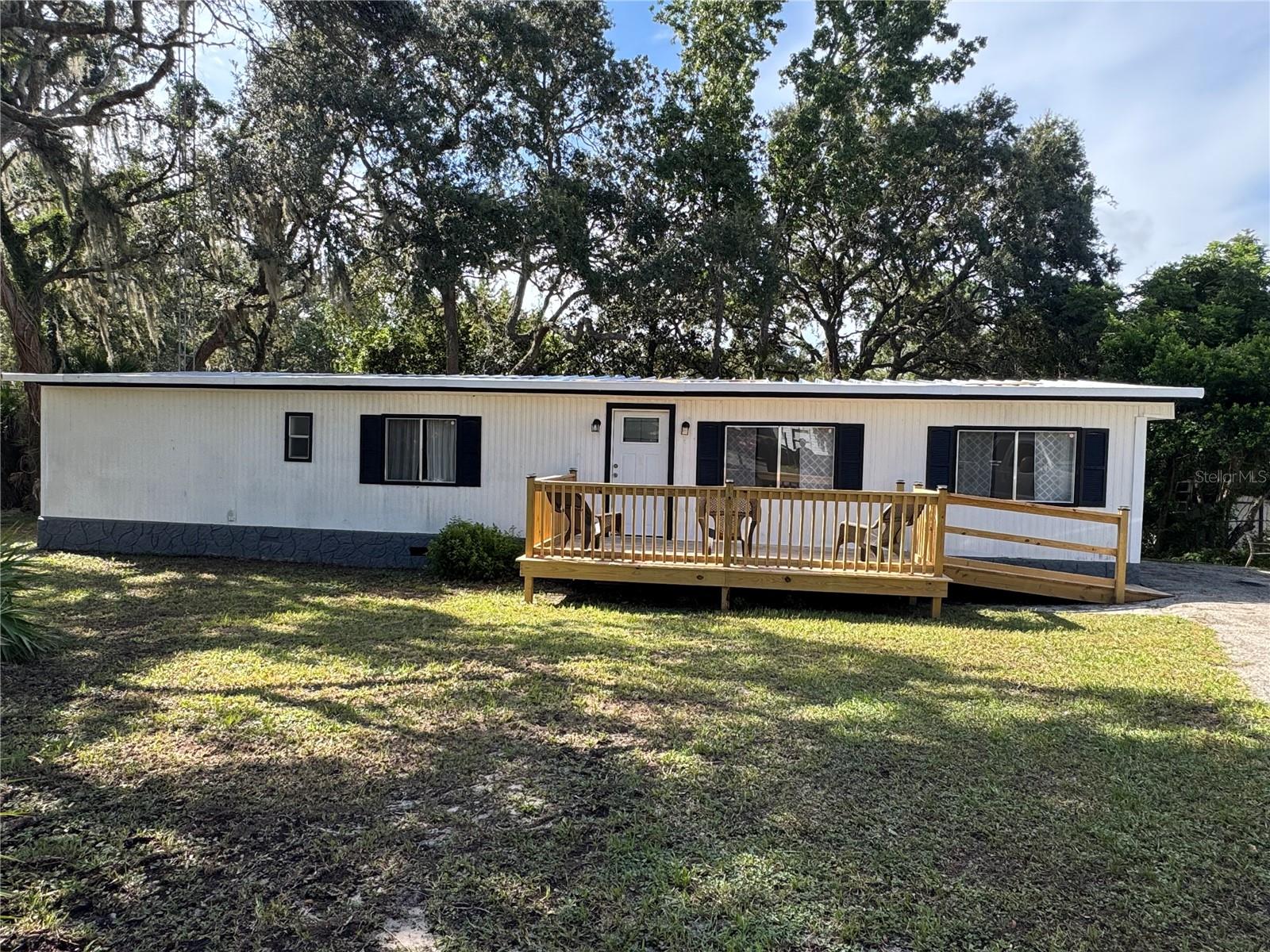Beautifully Remodeled Double-Wide in Silver Springs, Florida
Welcome to this stunning fully renovated double-wide home in the heart of Silver Springs. This move-in ready property has been thoughtfully
updated with:
New AC unit for comfort year-round
New electrical wiring, plumbing, and roof for peace of mind
Modern kitchen with new appliances, double farmhouse sinks, and stylish faucets
Luxury vinyl plank flooring throughout
Elegant light fixtures that brighten every room
Enjoy the outdoors with a spacious screened-in patio deck overlooking a lush green space—perfect for relaxing mornings or family gatherings. The home also features a front porch with a wheelchair-accessible ramp, making it comfortable for all.
Additional highlights include:
Fully furnished interior—just bring your personal touch!
A versatile shed that can serve as a workshop or entertainment space
Prime location surrounded by Florida’s famous natural springs for swimming and canoeing
Quick access to Highway 40, leading you straight to Daytona Beach or the Ocala National Forest for camping adventures
This home combines modern upgrades with Florida’s natural beauty, offering endless opportunities for leisure and lifestyle