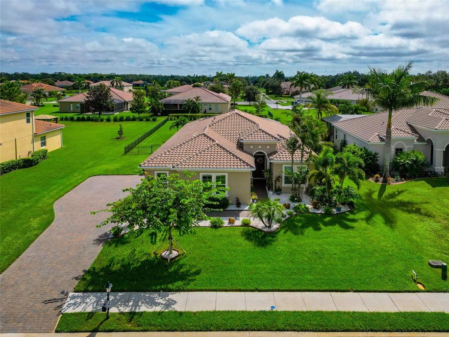 1/2 acre fenced lot, 3+ Car Garage 900 Sq ft, Salt, heated pool, Tile Roof, Paver extended driveway & 45 ft paver lanai, Luxury Vinyl & Tile flooring, Interior newly professionally painted, No CDD taxes & low HOAs. Situated on a private ½-ACRE lot, this beautifully maintained Hawthorne Model offers 2,530 sq. ft. of open-concept living with 3 bedrooms (including 2 en-suites) and 3 full baths, all with granite finishes. This popular model sits at a 50' ELEVATION & boasts a beautiful, HEATED SALTWATER POOL, tile roof, paver driveway, 45 FT EXTENDED LANAI, and a fully FENCED backyard—perfect for pets and outdoor living. Step inside and enjoy the coastal-inspired design featuring LUXURY VINYL FLOORING & TILE (no carpet), a spacious great room, and an inviting flow ideal for families or entertaining.  Calling all GARAGE LOVERS - this space is the ultimate! The oversized, side-load 3-car garage spans approximately 900 SQ FT (31’ x 29’) with space for a boat, large vehicles, gym equipment, storage & all of your toys. Roof racks included. The gourmet kitchen features gray cabinetry, a large granite island, stainless steel appliances, walk-in pantry, and plenty of room for a full-size dining table. Recent upgrades include a new dishwasher and microwave 2024. Interior - Great rm, kitchen, bath, foyer, BD #3 and home office just professionally painted for a fresh, bright look. 
Step outside to the expansive 45’ paver lanai featuring a CUSTOM DESIGNED HEATED SALTWATER POOL W/ SUN SHELF & BUBBLERS — an entertainer’s dream and a serene retreat surrounded by updated landscaping.
Additional updates *** All Carpeting removed, and Luxury Vinyl Flooring added, Epoxy Garage Flooring, Fenced Backyard, New Lanai Screening, Gutters, Additional Insulation added to attic for energy efficiency, Tall Toilets, 8 Ft Doors, Custom Wood Closet design in all bedrooms, freshly cleaned roof, and sealed driveway/lanai. The home is also wired for a generator.
The sought after Rye Wilderness is close to that makes Florida living great such as A-rated schools, nearby shopping and dining, quick access to Lakewood Ranch, and is just a short drive to world-famous Gulf beaches