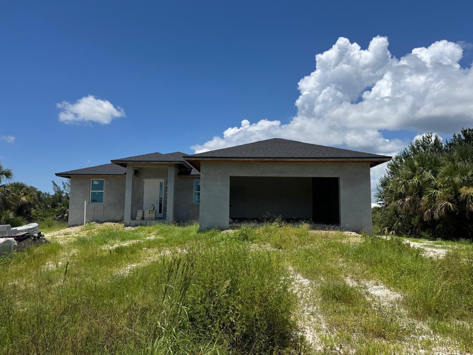 Under Construction. PERFECT FOR INVESTORS 4 bedroom 2 bathroom centrally located home which features a luxurious open floor plan with 1657 sq ft. of living space,a kitchen with a granite counter top, stainless steel appliances and wood cabinets .To complement the modern kitchen the whole house will have tile flooringand features many small details. The master bathrooms has a large walk in shower with tiles and granite counter top.As an added feature this home has hurricane impact windows for extra protection. This is a must see home.