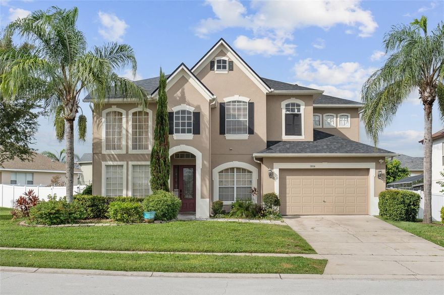 Wonderful 5-bedroom, 3-bathroom home located in the highly sought-after gated community of Willow on the Lake. This spacious, well-maintained home features numerous upgrades: Fully upgraded kitchen including granite countertops, upgraded bathrooms, tile/ wood, and laminate flooring throughout the property—no carpet! High ceilings on both floors and abundant natural light from extra windows create a bright, open feel. The layout includes a formal living room, dining room with butler’s pantry, and a kitchen that opens to the breakfast nook and family room, which leads out to a private patio through sliding glass doors. A full bedroom and bathroom are conveniently located on the first floor, along with a laundry room that connects to the garage. Upstairs, the primary suite offers double doors, a large walk-in closet, an upgraded bathroom, and a screened balcony. All other bedrooms are also located upstairs. Situated just minutes from major highways (SR-50, SR-408, SR-429, SR-414, SR-451, I-4, and the Florida Turnpike), this home offers quick access to Disney (25 mins), West Oaks Mall (5 mins), and Winter Garden Village (15 mins), as well as nearby shopping, dining, banks, gas, hospitals, and more.