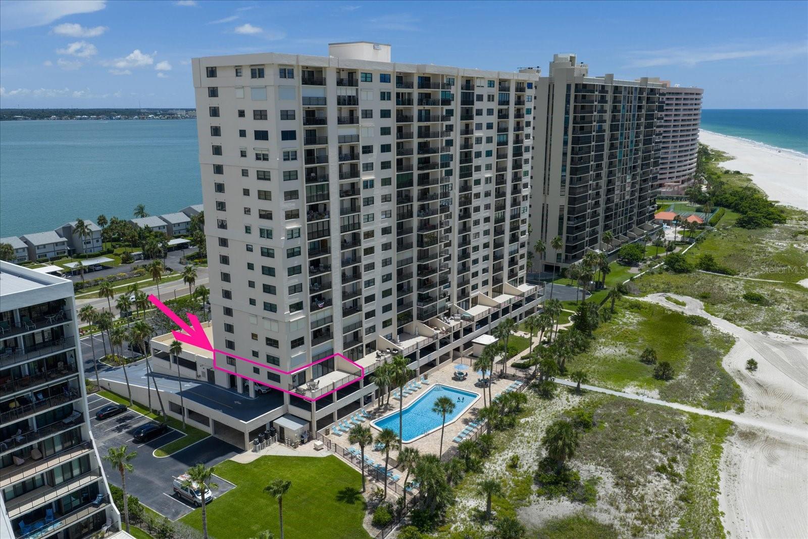 This corner unit isn’t just another condo—it’s one of the rarest offerings you’ll find on Sand Key, and truly one of a kind in gated, secure, and FULLY FUNDED Harbour Light Towers. At 1,208 square feet, it’s the largest individual condo in the building, and one of only six like it. What sets this completely renovated unit apart even further is the 495-square-foot veranda—this expansive space is unique to the third-floor end units. Ideal for creating unforgettable memories and enjoying postcard perfect sunsets unlike anywhere else. Inside, luxury vinyl plank flooring runs throughout, accented by tall baseboards, crown molding, and custom cornices above both sliders. The attention to detail is obvious, starting with a beautifully remodeled kitchen that’s so striking it was featured on the design consultant’s website. It includes Cambria quartz countertops, custom Fabuwood cabinetry with soft-close doors, LG appliances including a French door refrigerator that makes craft ice, an induction range, a water softener and osmosis system, and even a cleverly hidden laundry closet—an extremely rare feature in this building. The kitchen opens to a dining area with a built-in cabinet housing two wine coolers. The light-filled family room is a peaceful retreat, where walls of glass frame the expansive veranda and draw your eyes straight to the shimmering Gulf beyond. With soft natural light filtering in and unobstructed views of sand, sea, and sky, it’s a space that invites you to unwind and simply take it all in. The spacious primary bedroom offers a custom walk-in closet and an ensuite with a walk-in shower and quartz counters. The additional bedroom is filled with natural light and a walk-in closet with a beautifully renovated full bathroom across the hall. All windows and sliders are top-quality PGT impact windows . Located at the far end of the third floor—well above flood zones—this unit offers complete privacy and convenient access to your assigned parking just one flight down via the stairwell just outside your front door. Enjoy the peace of mind that comes from a completed Milestone Inspection, Fully funded HOA, completed exterior renovations, common area weather decking, new roof, entry doors brick entrance, security system, cameras, parking areas repaved and 24 hour security! Simply put—this condo doesn’t compare to anything else currently available, here or anywhere nearby. If you’ve been waiting for something truly special, you’ve found it.