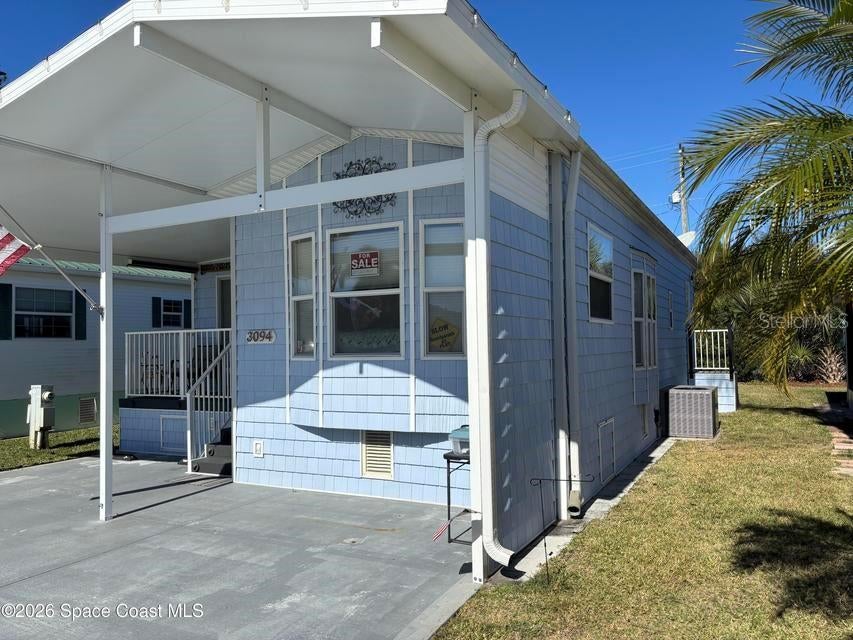 Photo of 3094 Centaur Lane #21, Titusville, FL 32796 (MLS # O6449496)