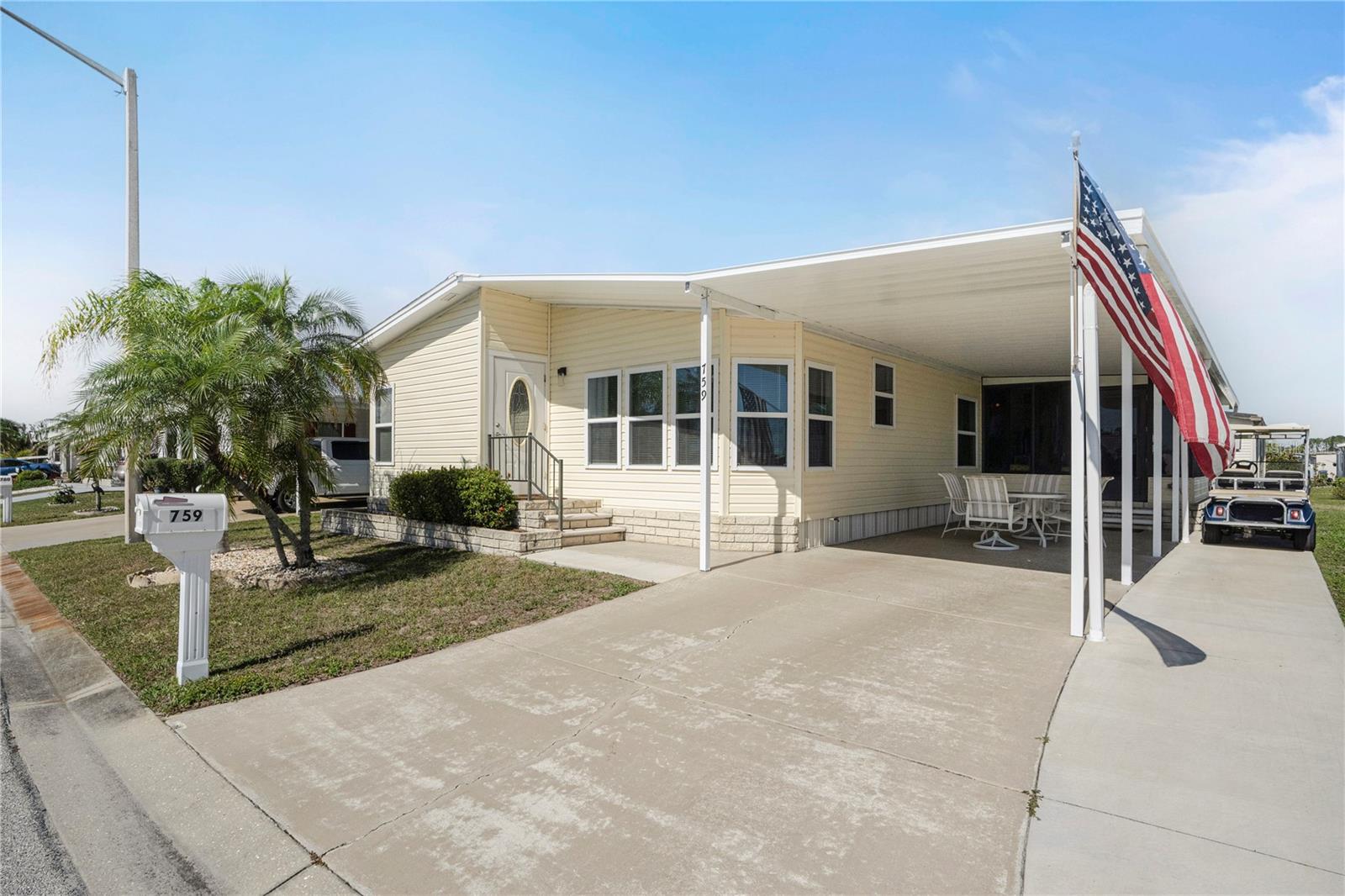 $29K PRICE REDUCTION on this Stunning furnished home in 55+ GULF ACCESS waterfront community with serene lake views! Wow, prepare to be impressed. This stylish and spacious 2-bedroom, 2-bathroom residence has water views, an upscale coastal vibe and a long list of recent upgrades. Beautifully furnished with golf cart included, this 1,464 SF home is one of the larger ones in the community. Enter into light filled rooms, cathedral ceilings, extra wide hallways and a calming, neutral color palette with lovely accents and artwork. Relax or entertain while taking in sparkling lake views from the front wall of windows or the comfy, elevated, air-conditioned and enclosed lanai. So much space here! A huge well-appointed living room, charming dining area with display and storage cabinetry, nice kitchen with pantry and updated countertops, roomy 240 SF primary suite with walk-in closet and French doors to the ensuite bathroom plus a 2nd bedroom that would please any guest. This property features updates that ensure comfort and convenience: a roof and A/C system only 2.5 years old, beautiful luxury vinyl flooring, updated windows for energy efficiency, vinyl siding, gutters and downspouts, lanai mini-split, shower surround, paint, etc. As part of this vibrant community, enjoy Gulf access via the Myakka River with a rare 90-slip marina—perfect for boating and fishing enthusiasts. With low HOA fees of $150 per month and an optional boat slip for only $100 annually, this is an opportunity not to be missed. Amenities include two pools, a spa, massive clubhouse with dances, parties, talent shows, trivia, card games and more. Close to beaches, dining, shopping, farmers markets and quality medical services. Whether you're looking for a permanent residence or a seasonal getaway, this home offers casual elegance with modern amenities in a very scenic setting. Don’t wait—schedule your private tour today and experience firsthand all that this exceptional property has to offer!